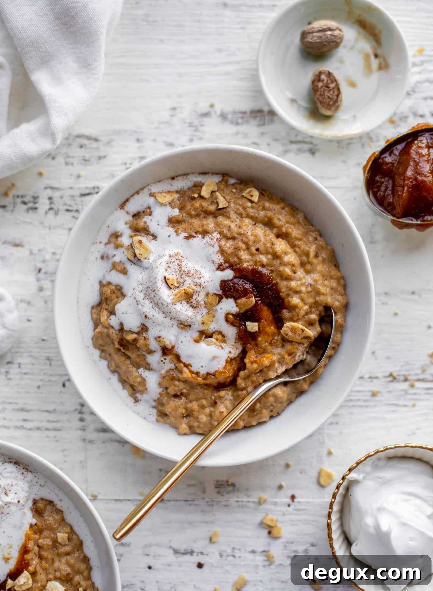 pumpkin pie oatmeal with coconut cream and almonds