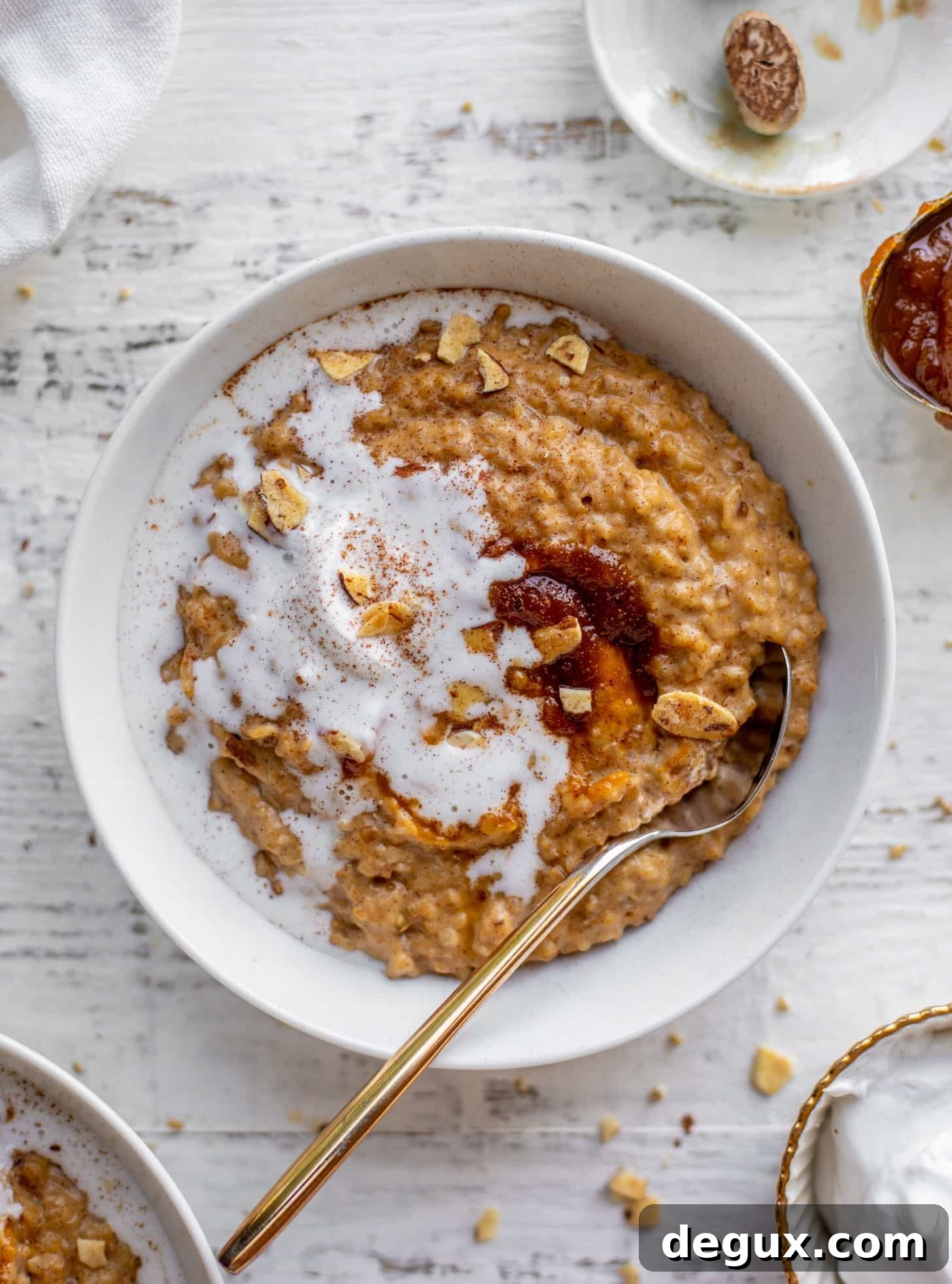pumpkin pie oatmeal with coconut cream and almonds