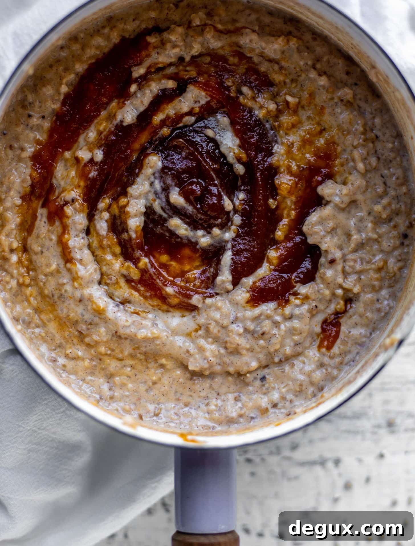 swirling pumpkin butter in pumpkin pie oatmeal 