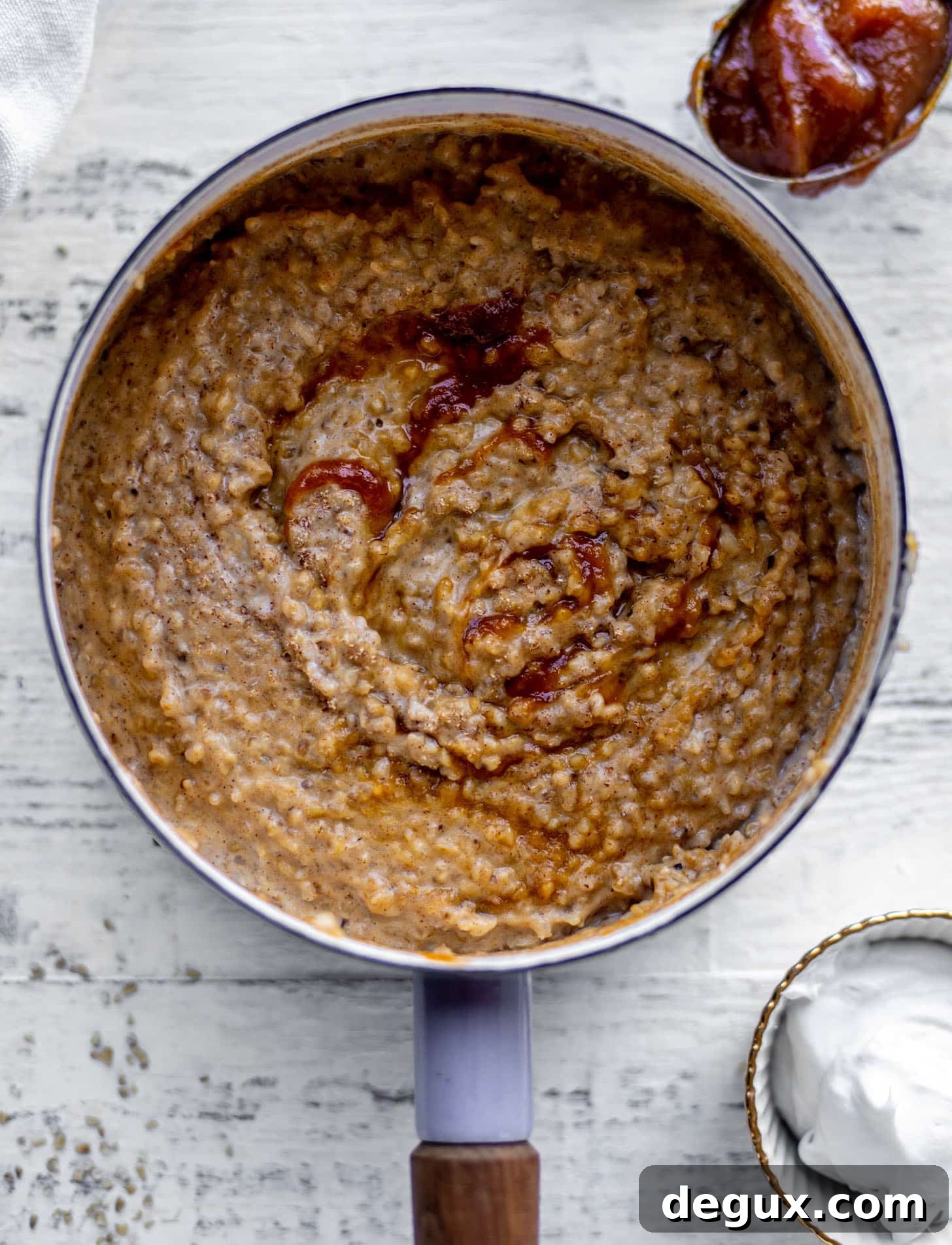 pumpkin pie oatmeal with coconut cream and almonds