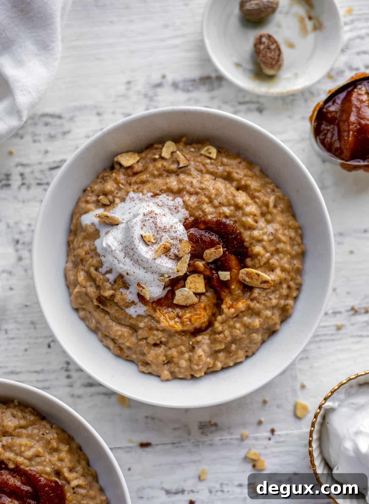 pumpkin pie oatmeal with coconut cream and almonds