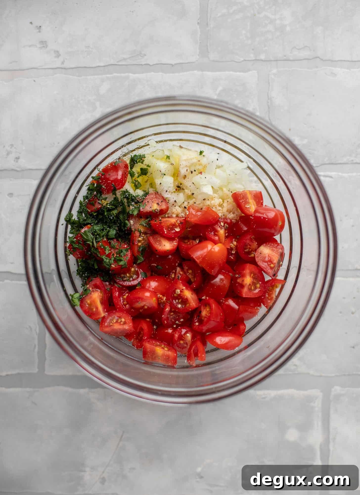 tomatoes, basil, onion, garlic in a bowl