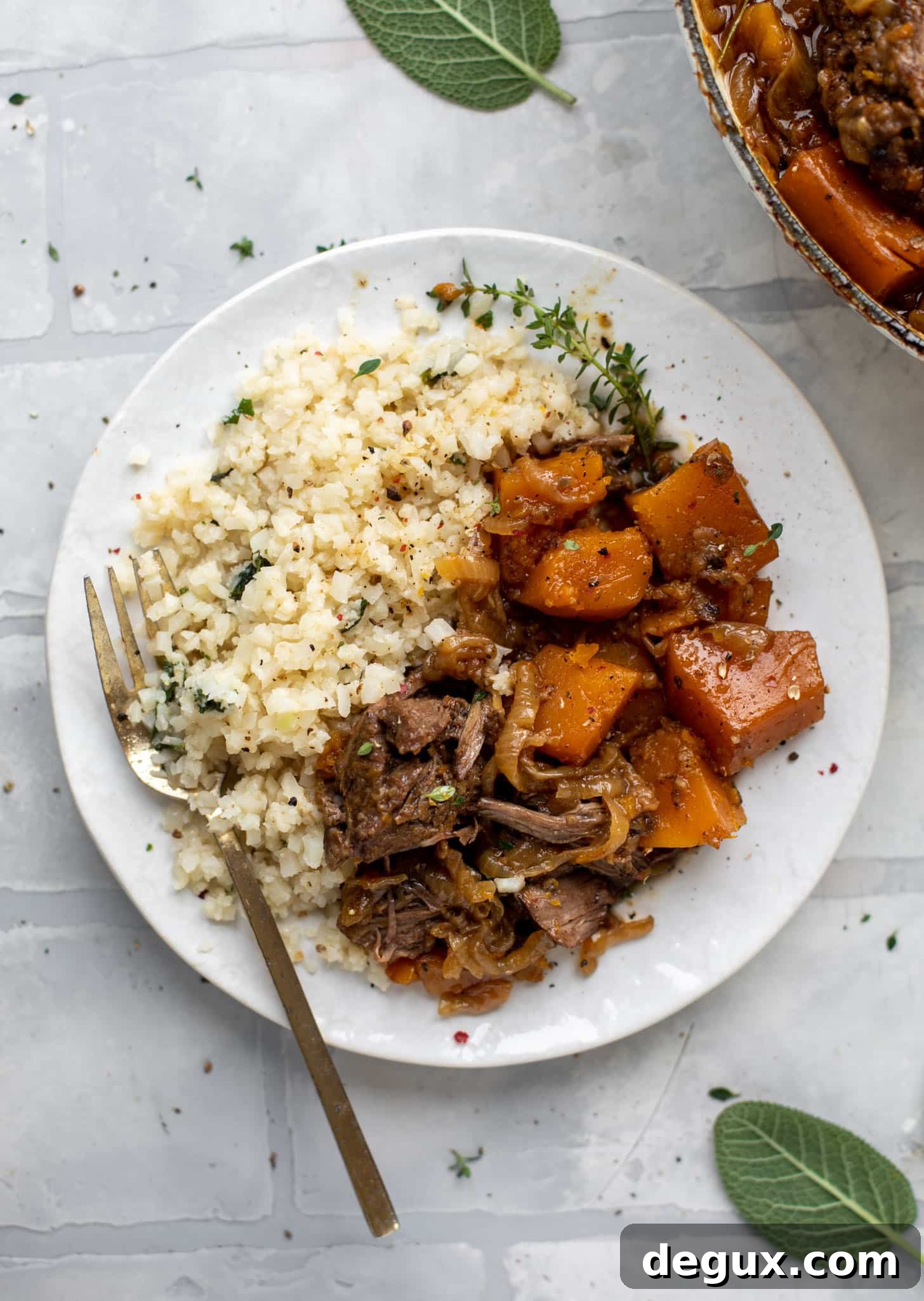 cider braised pot roast with caramelized onions, butternut squash and cauliflower rice