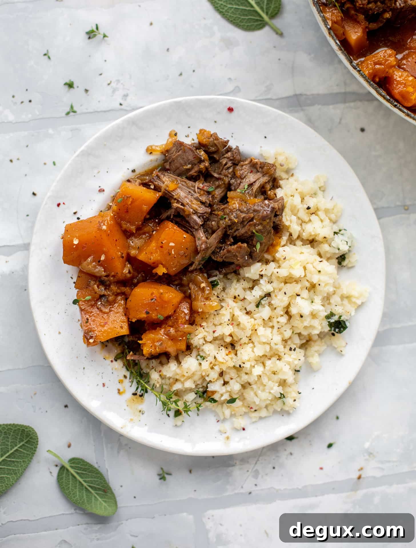 cider braised pot roast with caramelized onions, butternut squash and cauliflower rice