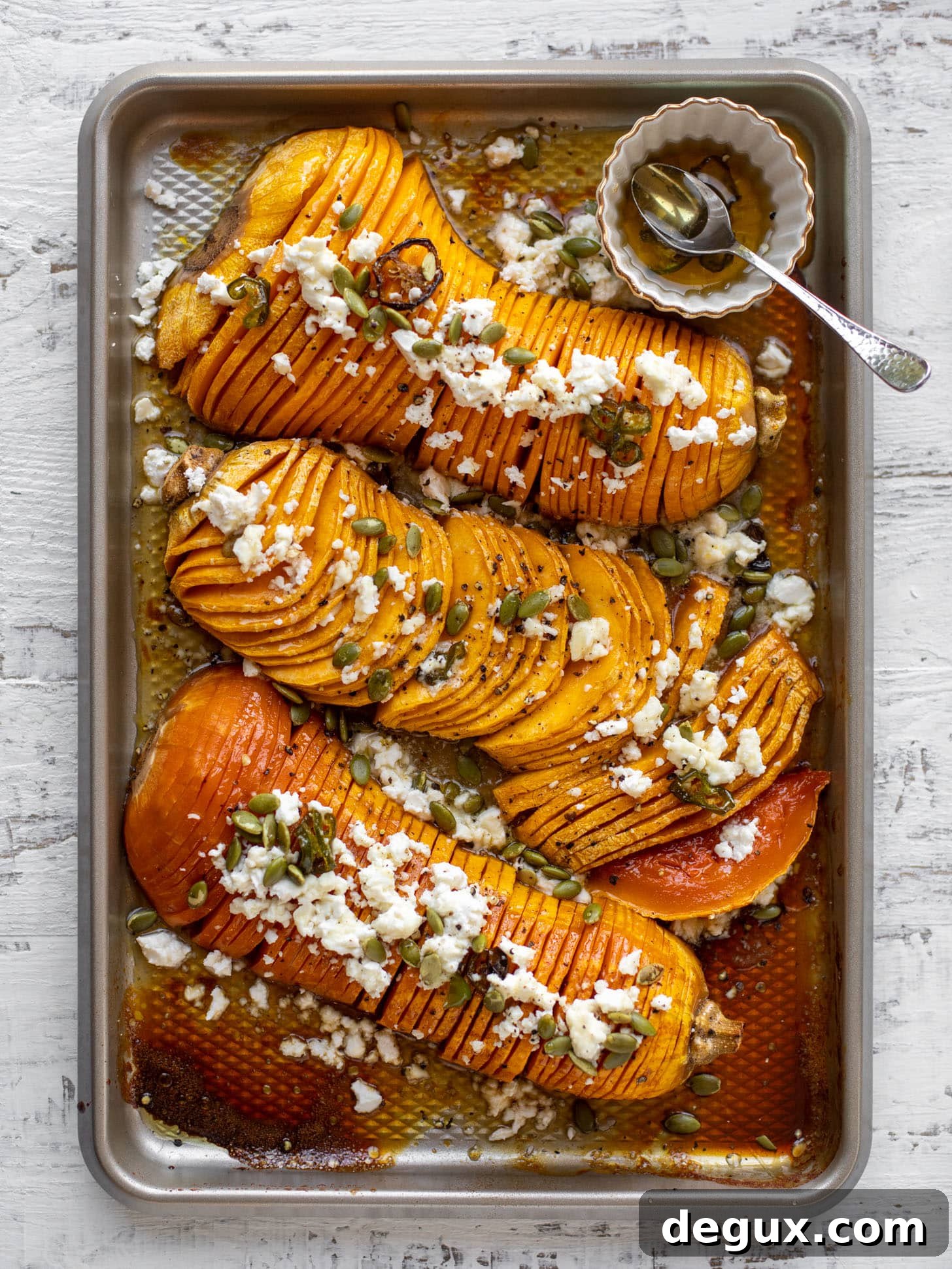 Spicy Honey Hasselback Butternut Squash with Feta & Pepitas 2 hot honey hasselback butternut squash with feta and pepitas