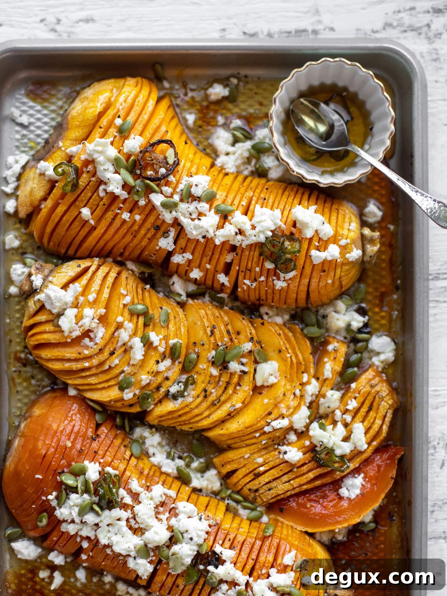 Spicy Honey Hasselback Butternut Squash with Feta & Pepitas 12 hot honey hasselback butternut squash with feta and pepitas