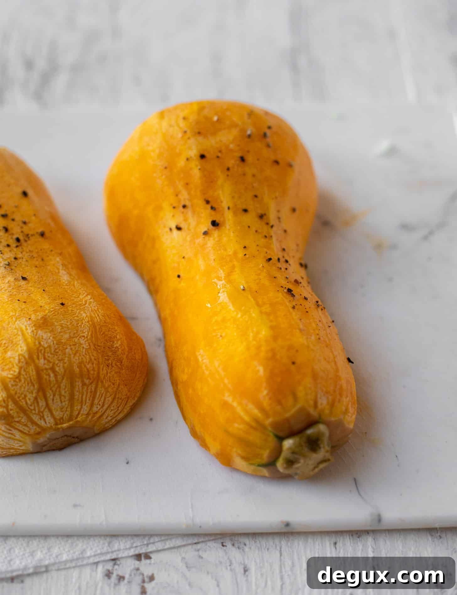 Spicy Honey Hasselback Butternut Squash with Feta & Pepitas 3 halved butternut squash