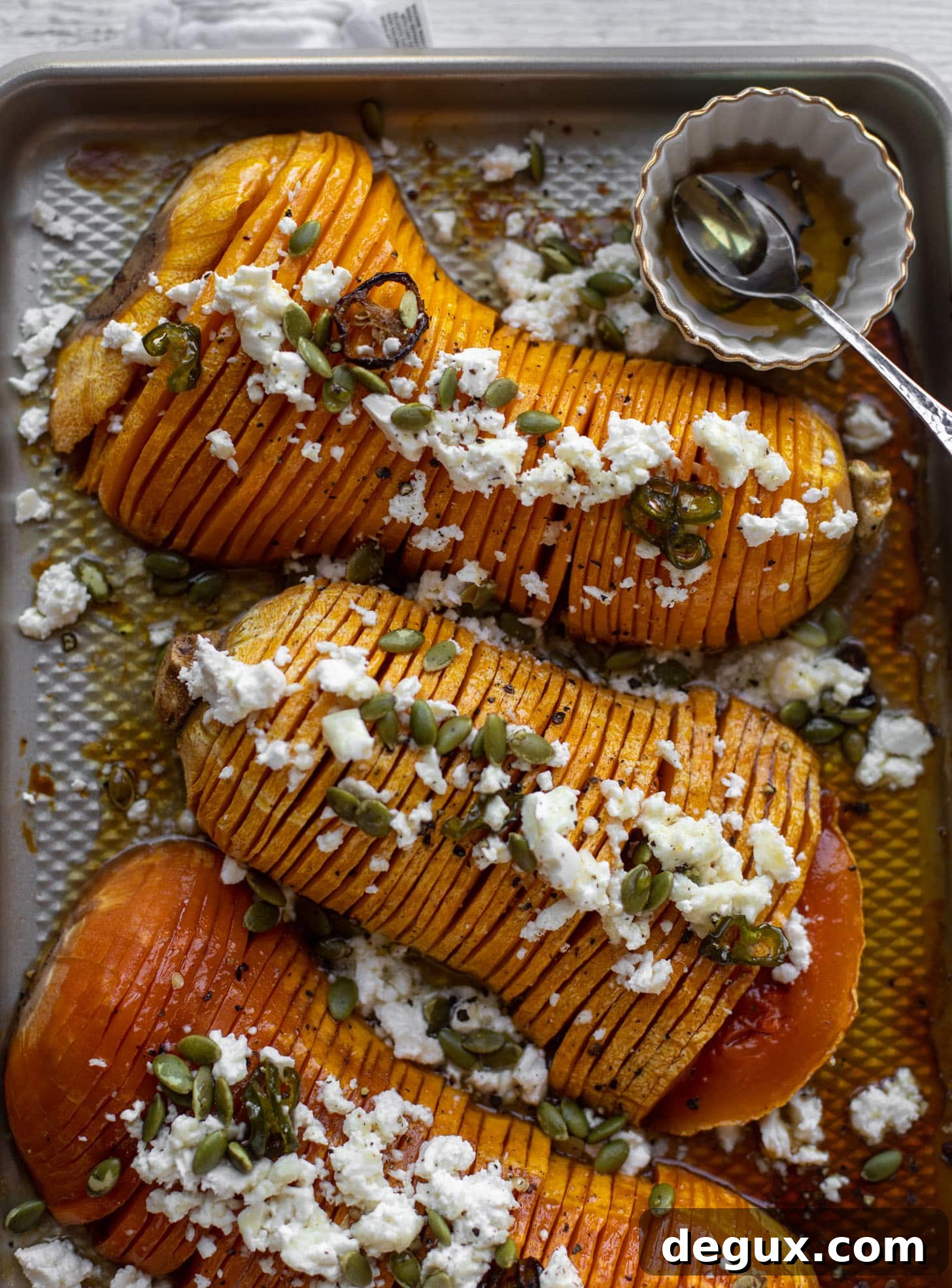 Spicy Honey Hasselback Butternut Squash with Feta & Pepitas 6 hot honey hasselback butternut squash with feta and pepitas