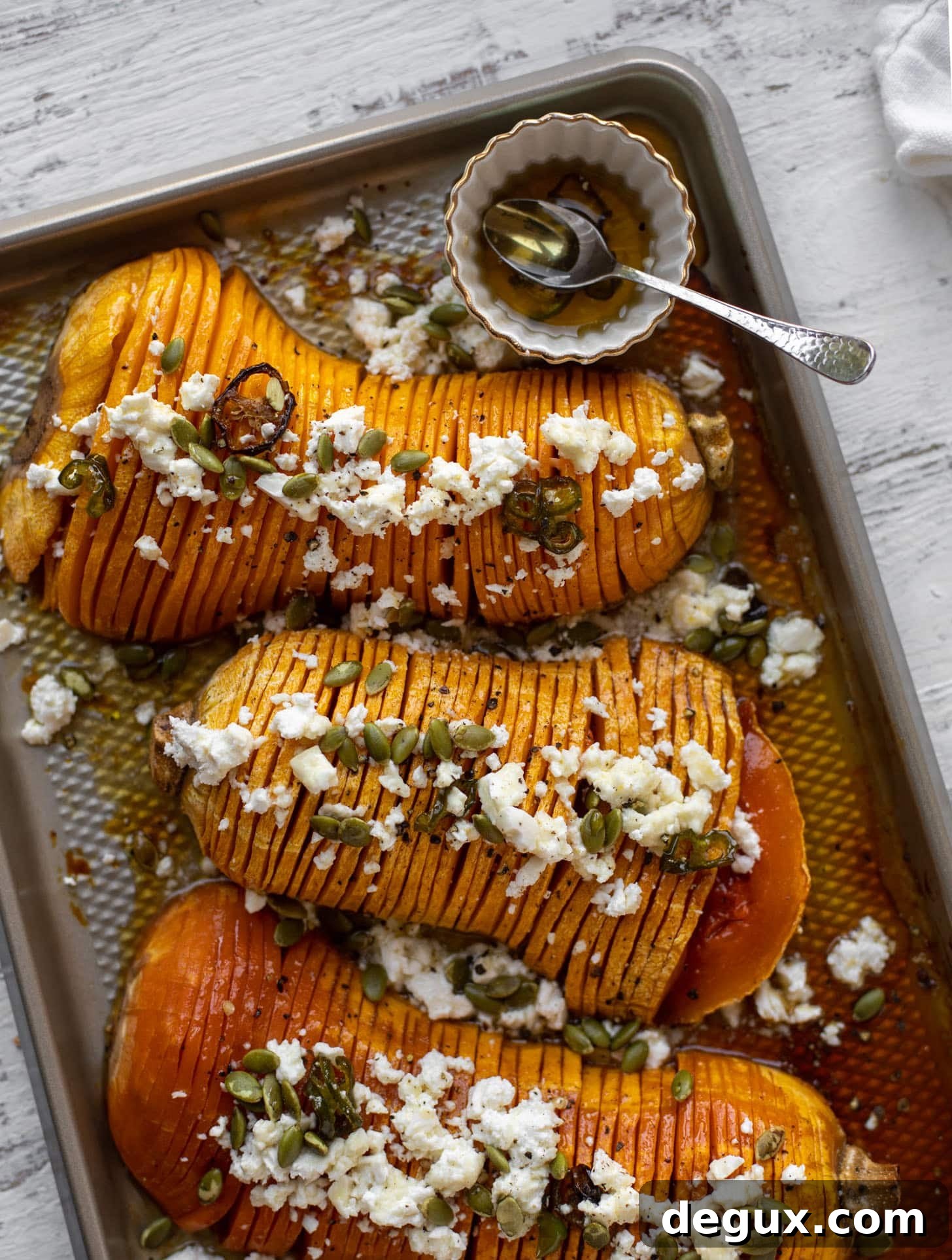 Spicy Honey Hasselback Butternut Squash with Feta & Pepitas 7 hot honey hasselback butternut squash with feta and pepitas