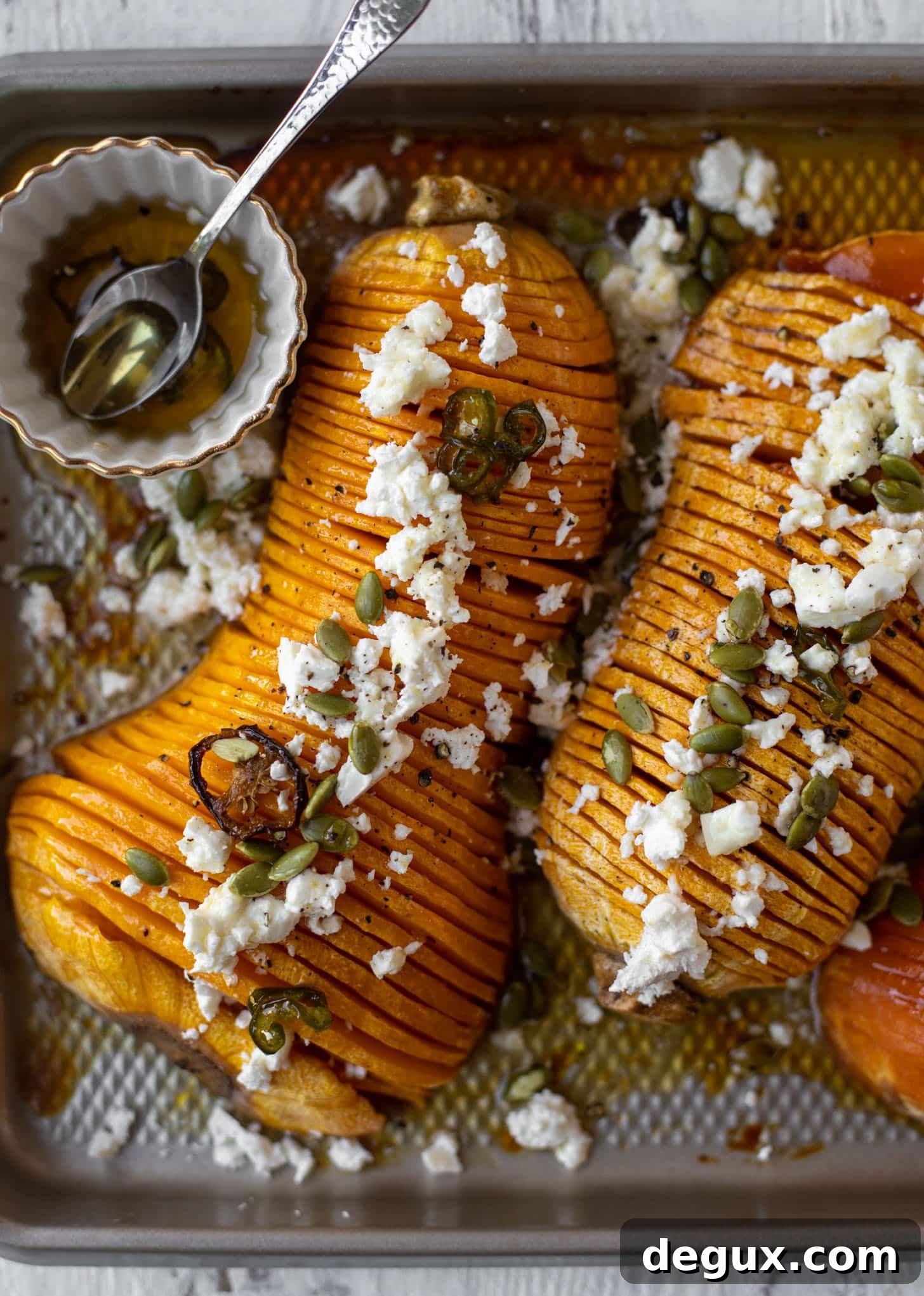 Spicy Honey Hasselback Butternut Squash with Feta & Pepitas 8 hot honey hasselback butternut squash with feta and pepitas