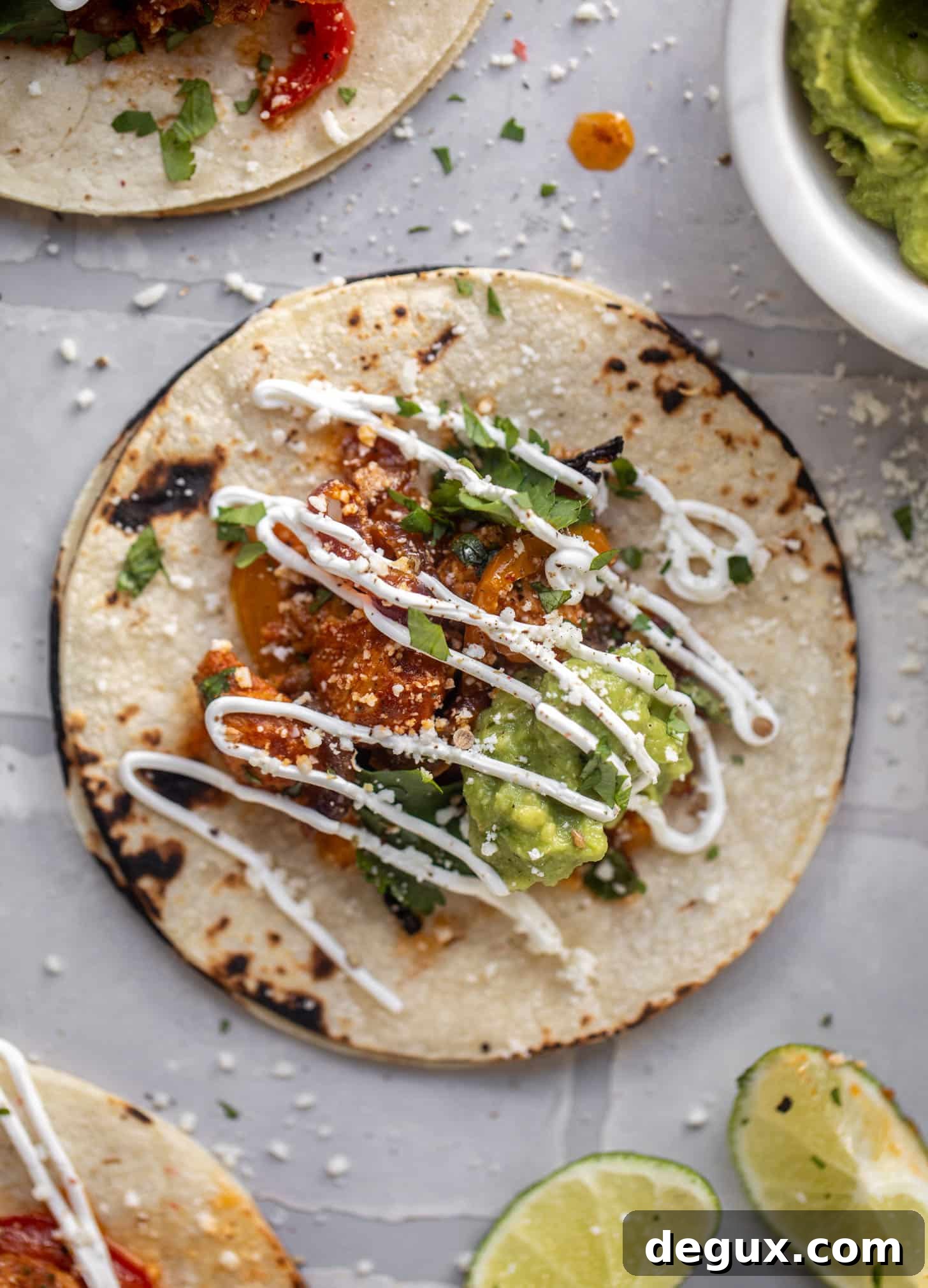 Lime Sheet-Pan Chicken Fajitas with Quick Guacamole 9 sheet pan chicken fajitas on a tortilla