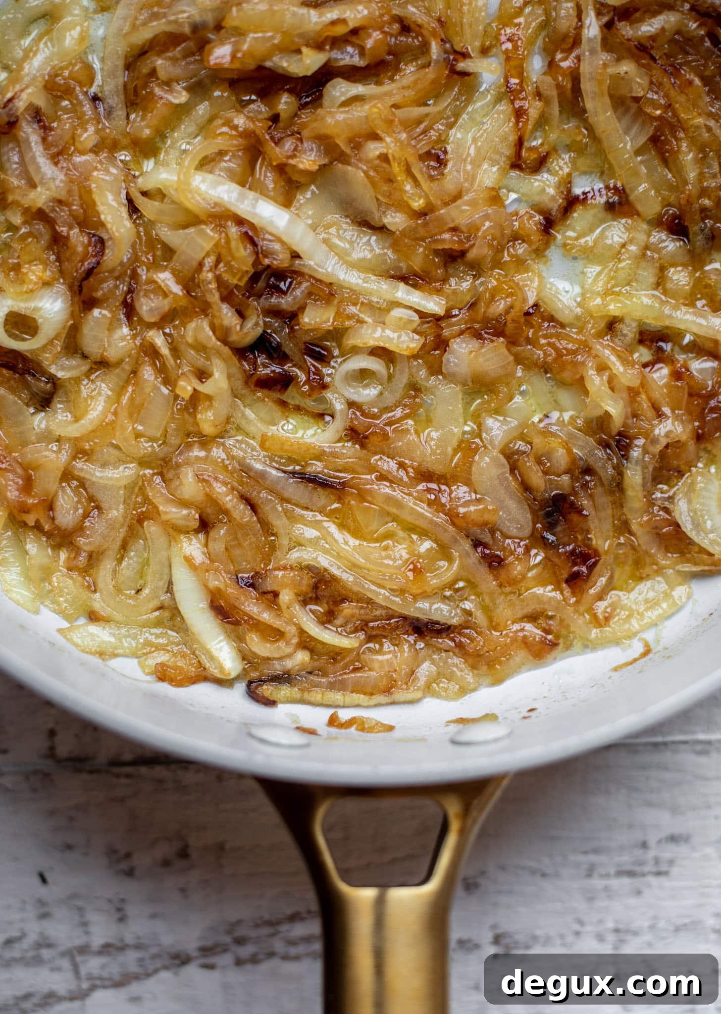 Caramelized Onion, Apple & Brie Tart Recipe — Savory-Sweet Tart 3 caramelized onions in a skillet