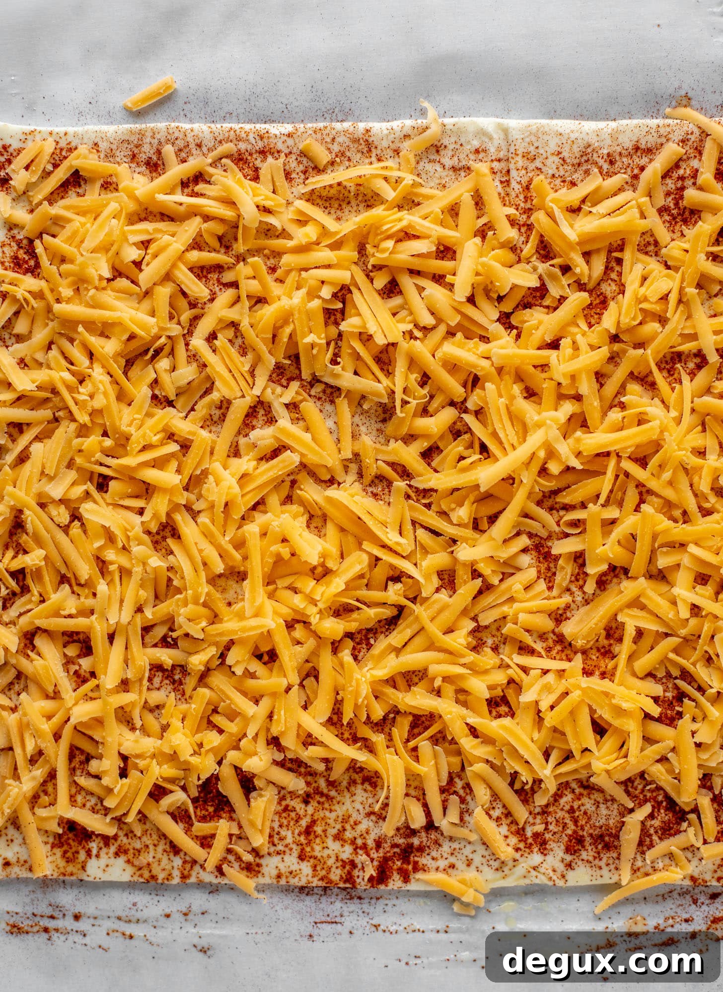 chili powder and cheddar on puff pastry