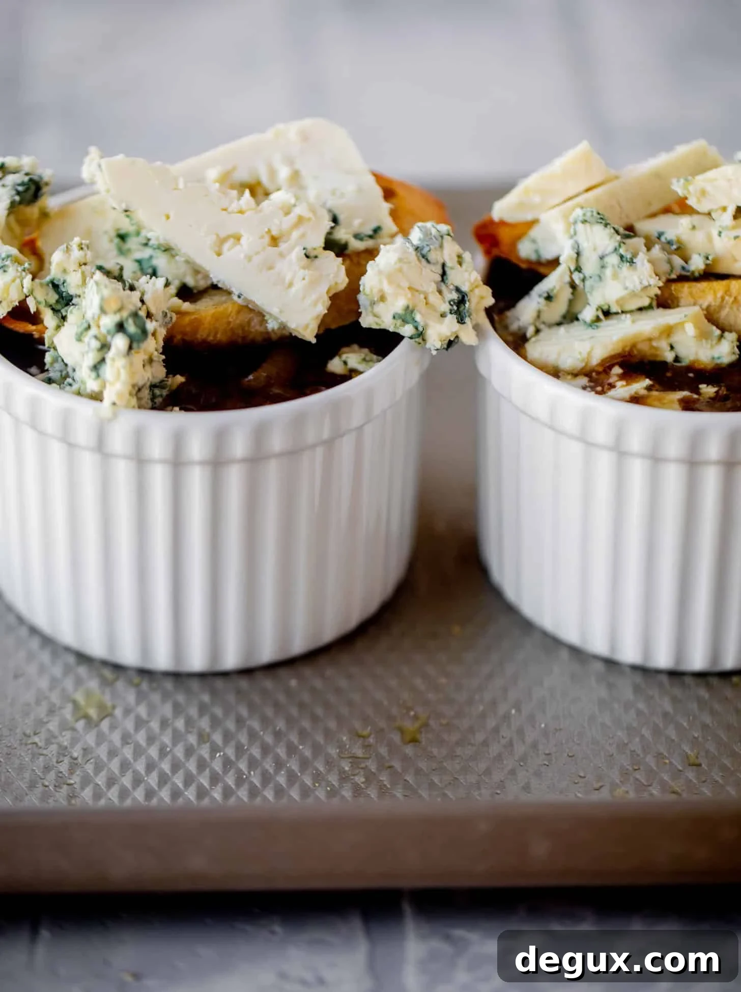 french onion soup topped with baguettes and blue cheese