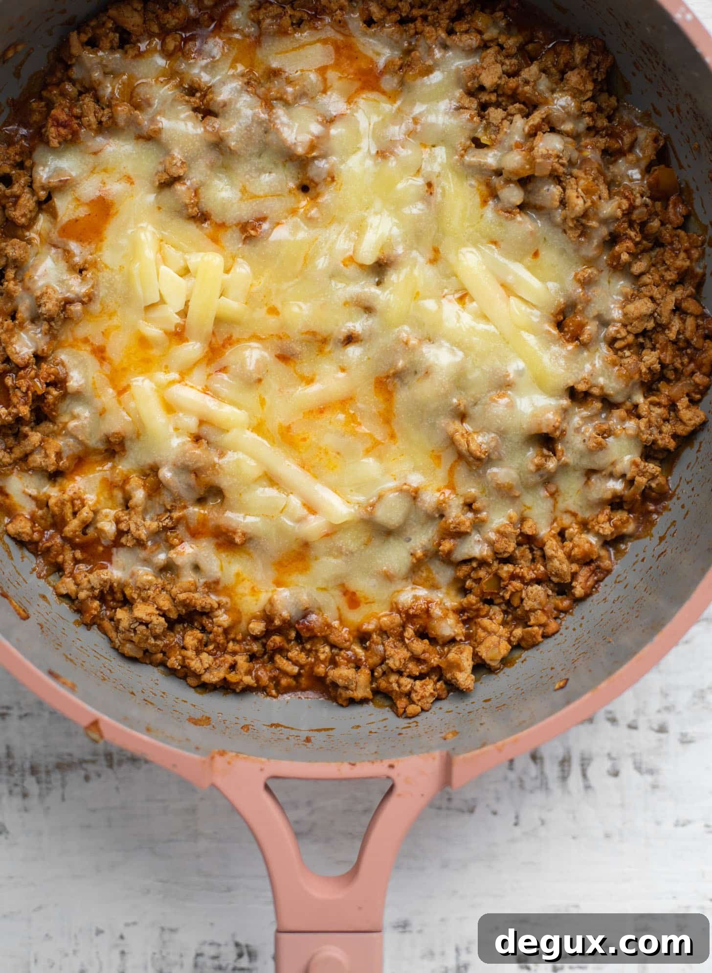 turkey taco meat with melted cheddar