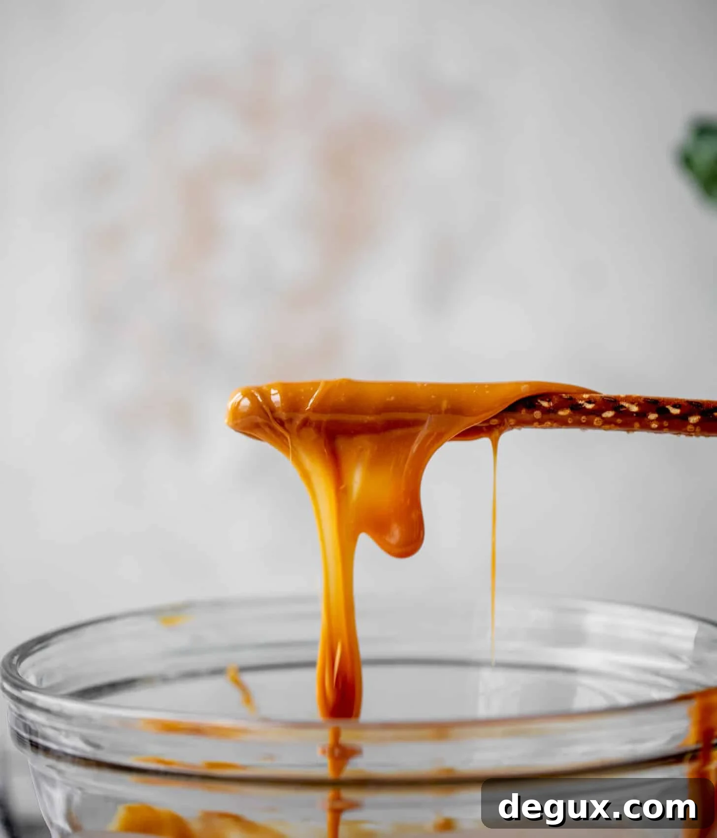 dipping pretzels in caramel