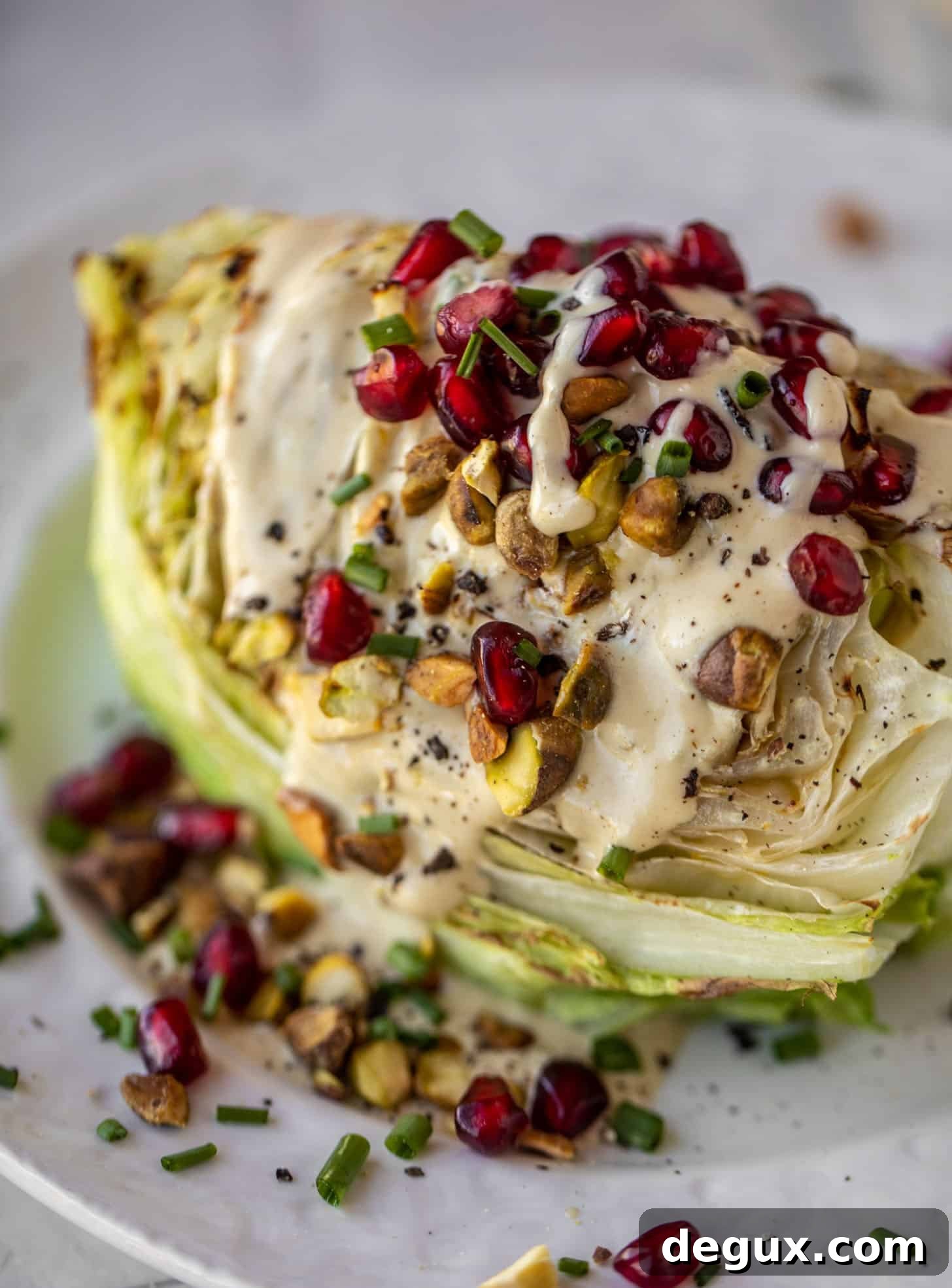 Broiled Iceberg Wedge Salad with Pomegranate Seeds & Pistachios 11 broiled wedge salad with pomegranates and pistachios