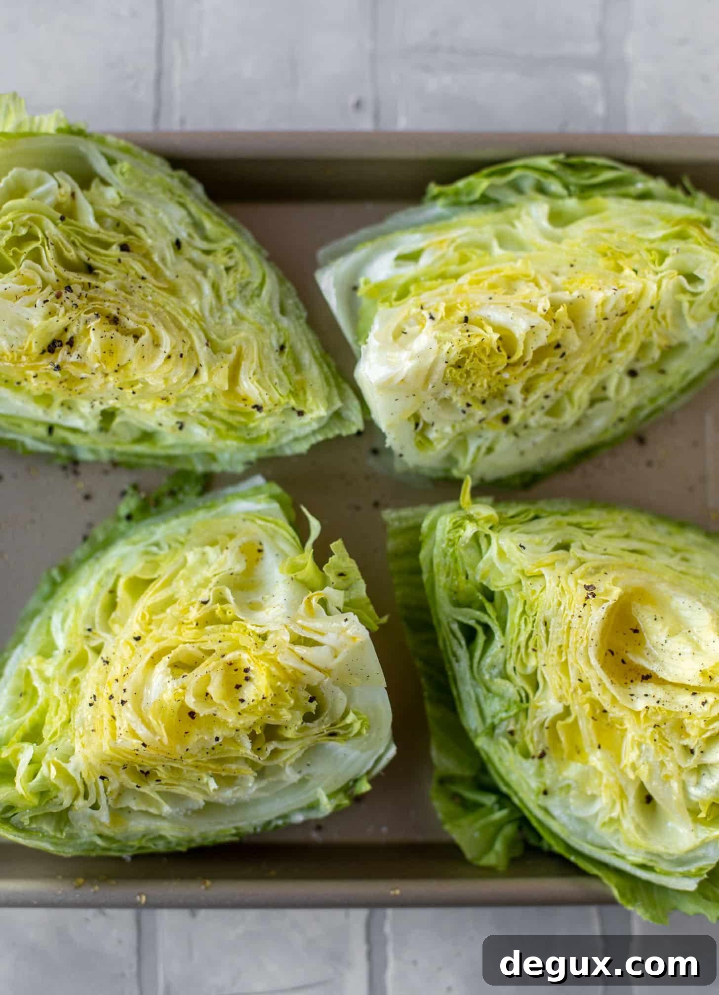 Broiled Iceberg Wedge Salad with Pomegranate Seeds & Pistachios 3 iceberg wedges ready for the oven