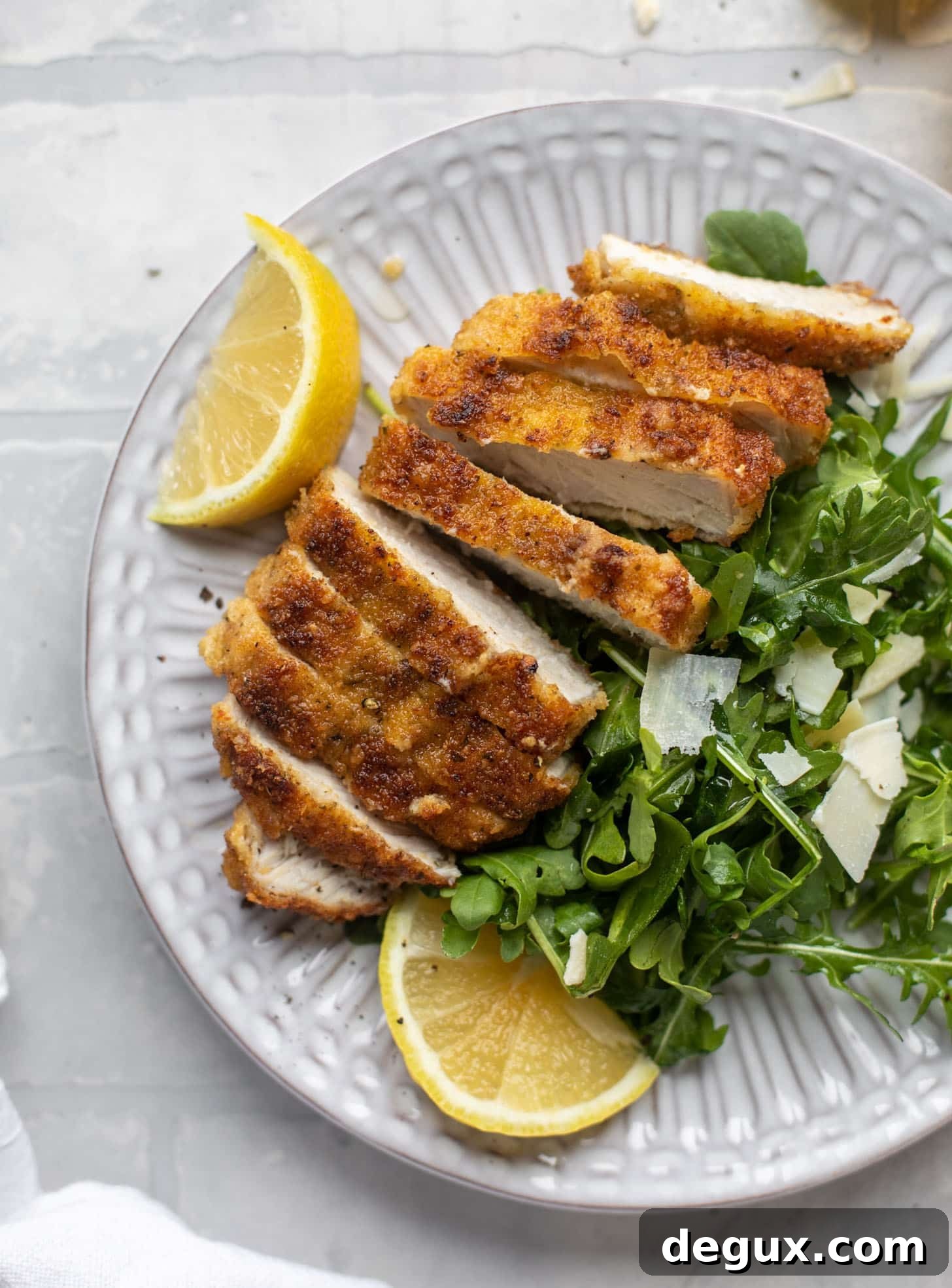 Crispy Pork Milanese with Lemon-Parmesan Arugula Salad 11 pork milanese with lemon arugula greens