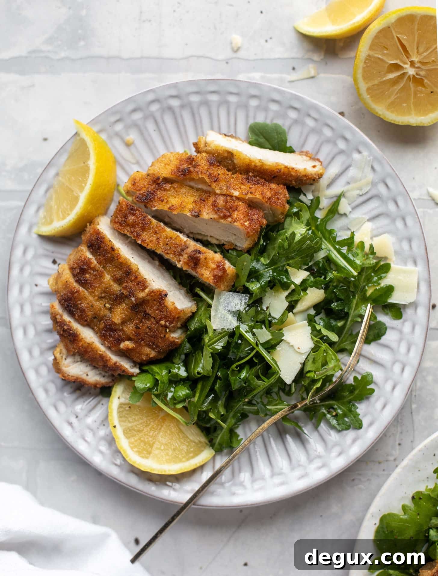 Crispy Pork Milanese with Lemon-Parmesan Arugula Salad 9 pork milanese with lemon arugula greens