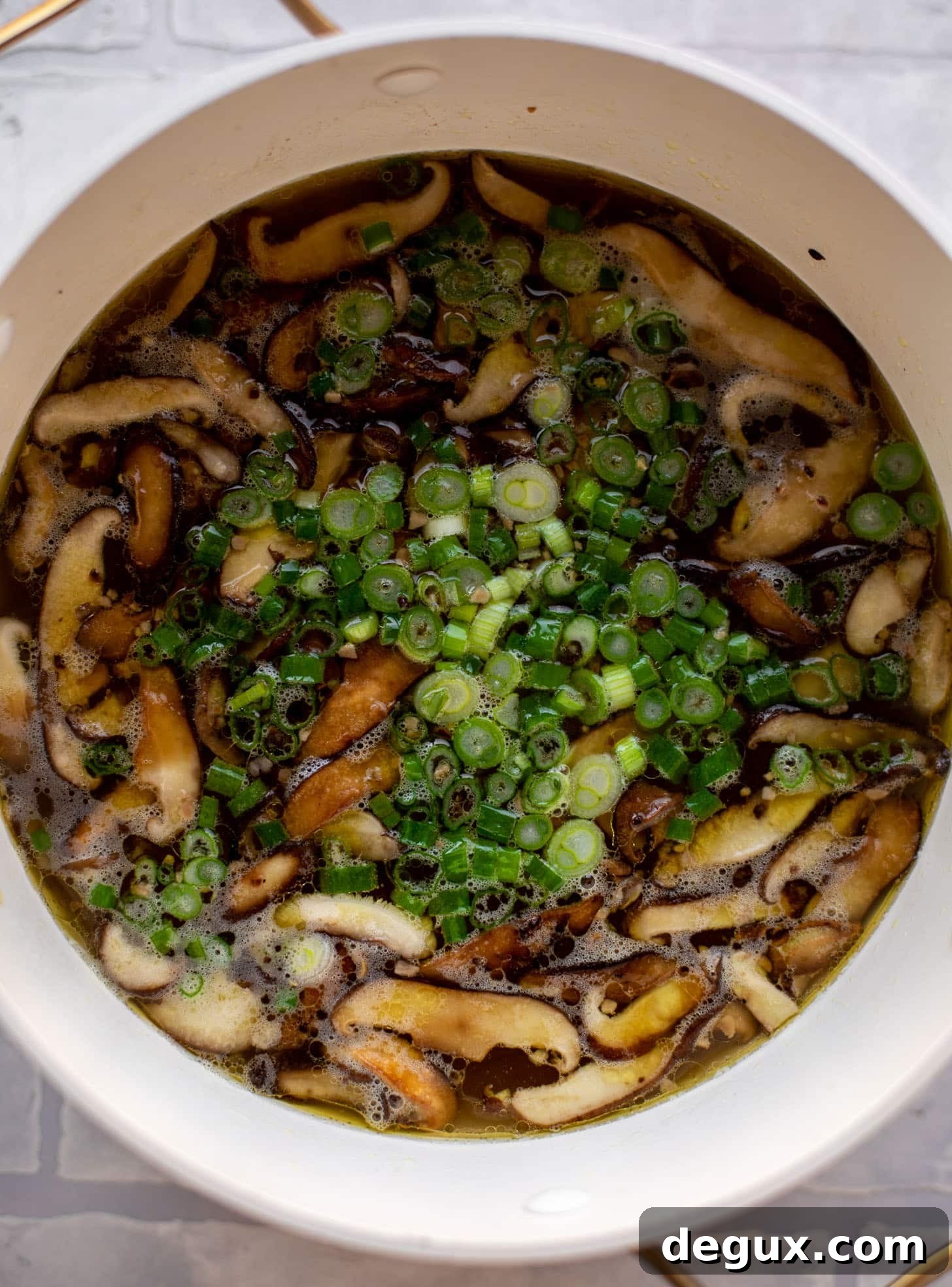 Weeknight Potsticker Soup Recipe — Quick Asian-Inspired Dinner 3 broth with shiitake mushrooms and scallions