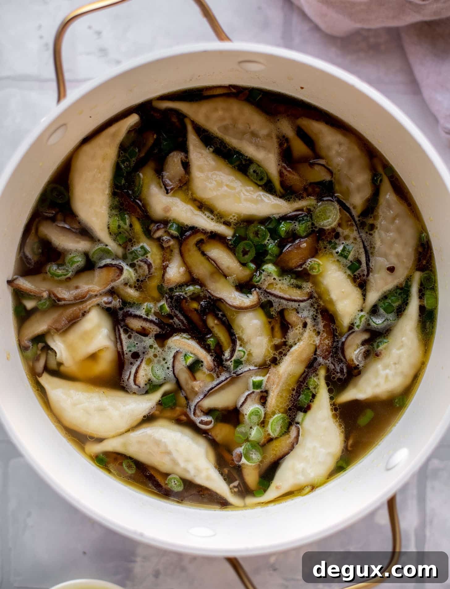 Weeknight Potsticker Soup Recipe — Quick Asian-Inspired Dinner 4 broth with mushrooms and potstickers