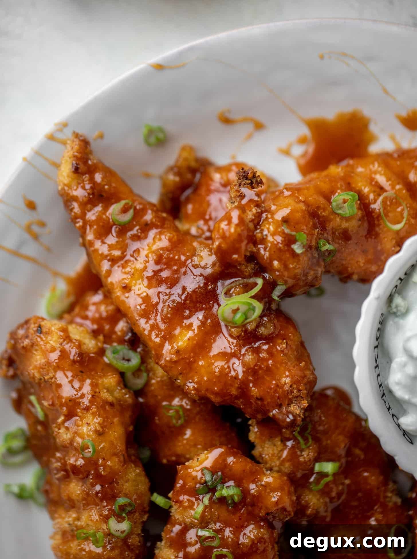 sticky chicken fingers with yogurt blue cheese sauce