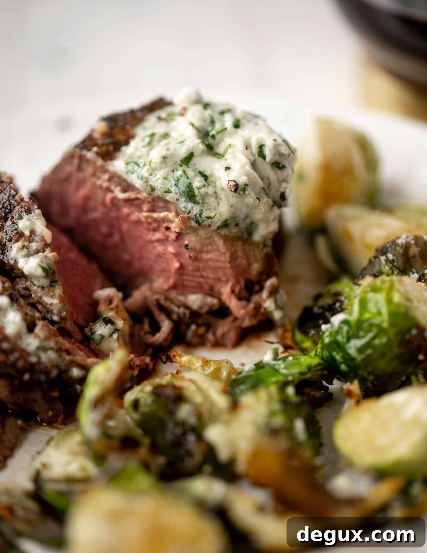 Seared Filet Mignon with Blue Cheese Butter 12 filet mignon with blue cheese butter and cacio e pepe brussels