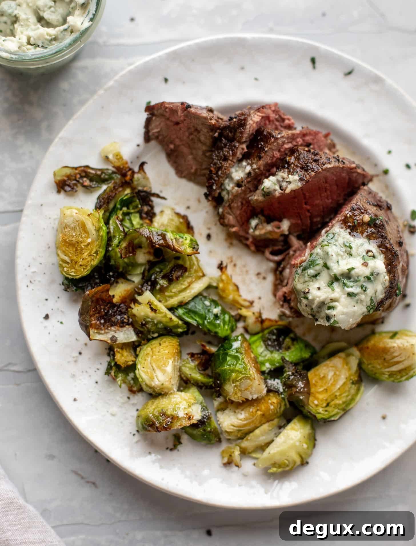 filet mignon with blue cheese butter and cacio e pepe brussels