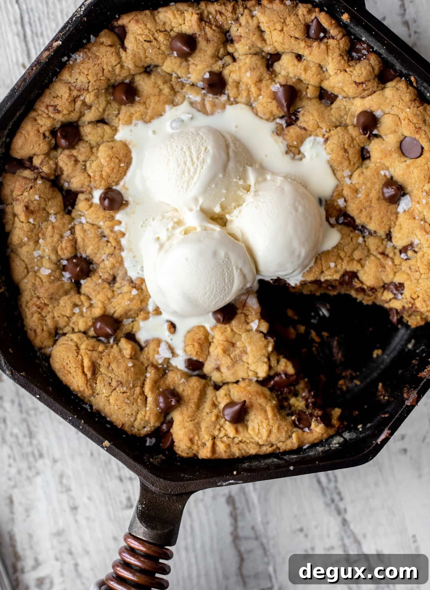 chewy chocolate chip skillet cookie topped with ice cream
