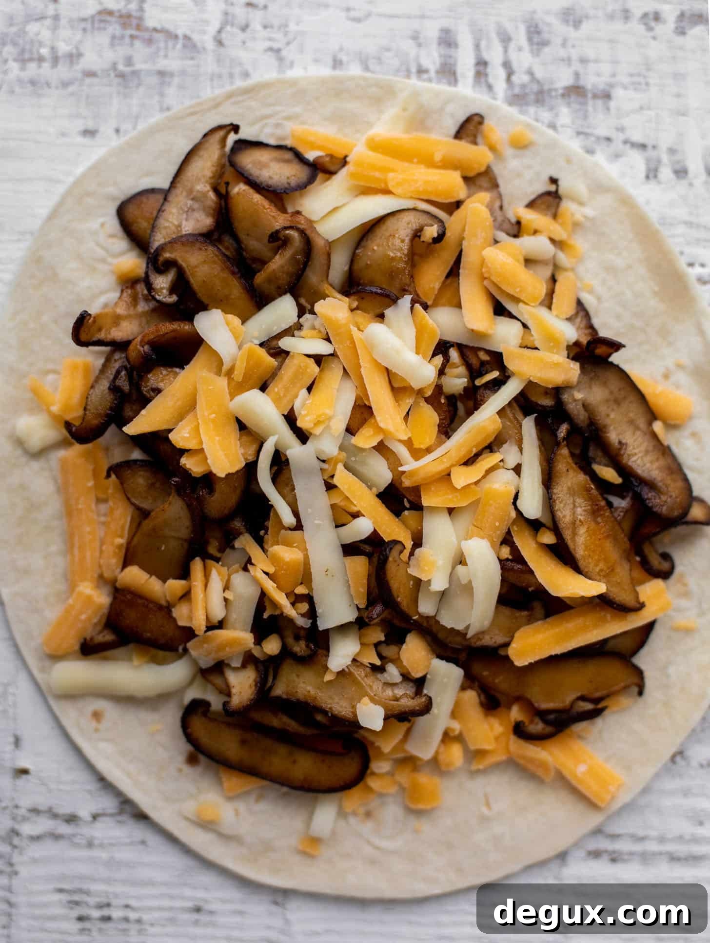 Smoky Shiitake Mushroom Quesadillas with Avocado Cream Sauce 5 mushroom and cheese on tortilla