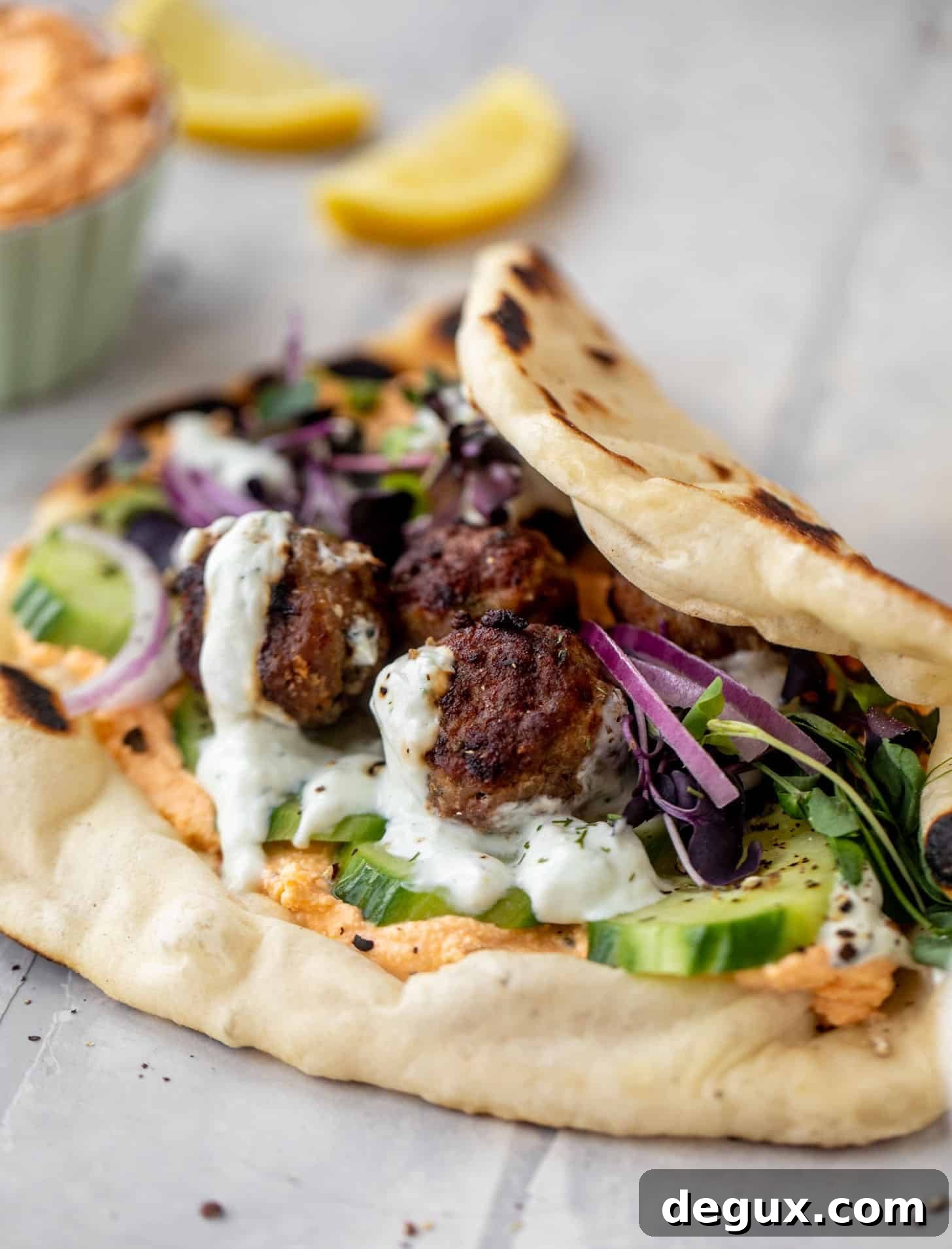 Chicken Meatball Pitas with Roasted Red Pepper Whipped Feta Recipe 6 chicken meatball pitas with roasted red pepper whipped feta