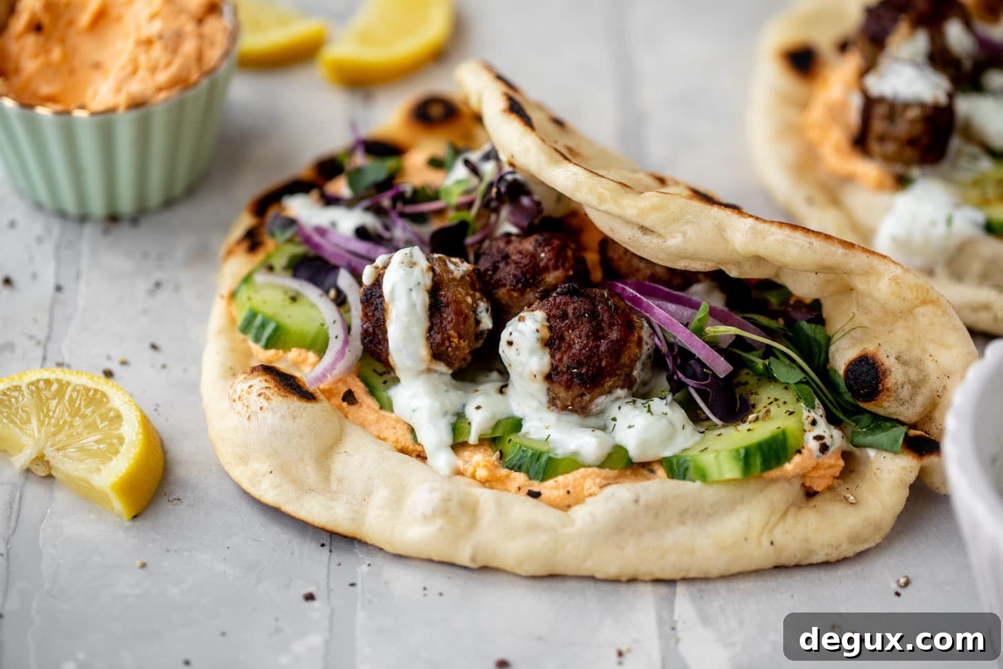 Chicken Meatball Pitas with Roasted Red Pepper Whipped Feta Recipe 8 chicken meatball pitas with roasted red pepper whipped feta