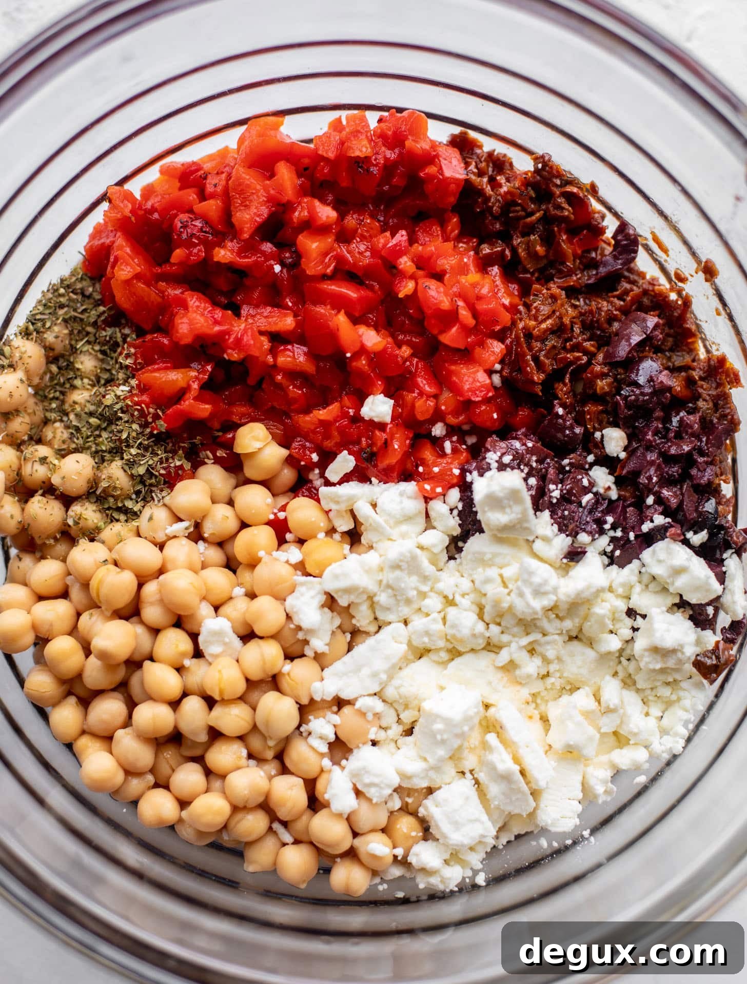 Make-Ahead Mediterranean Marinated Chickpea Salad 3 roasted red peppers, sun dried tomatoes, chickpeas, feta, spices