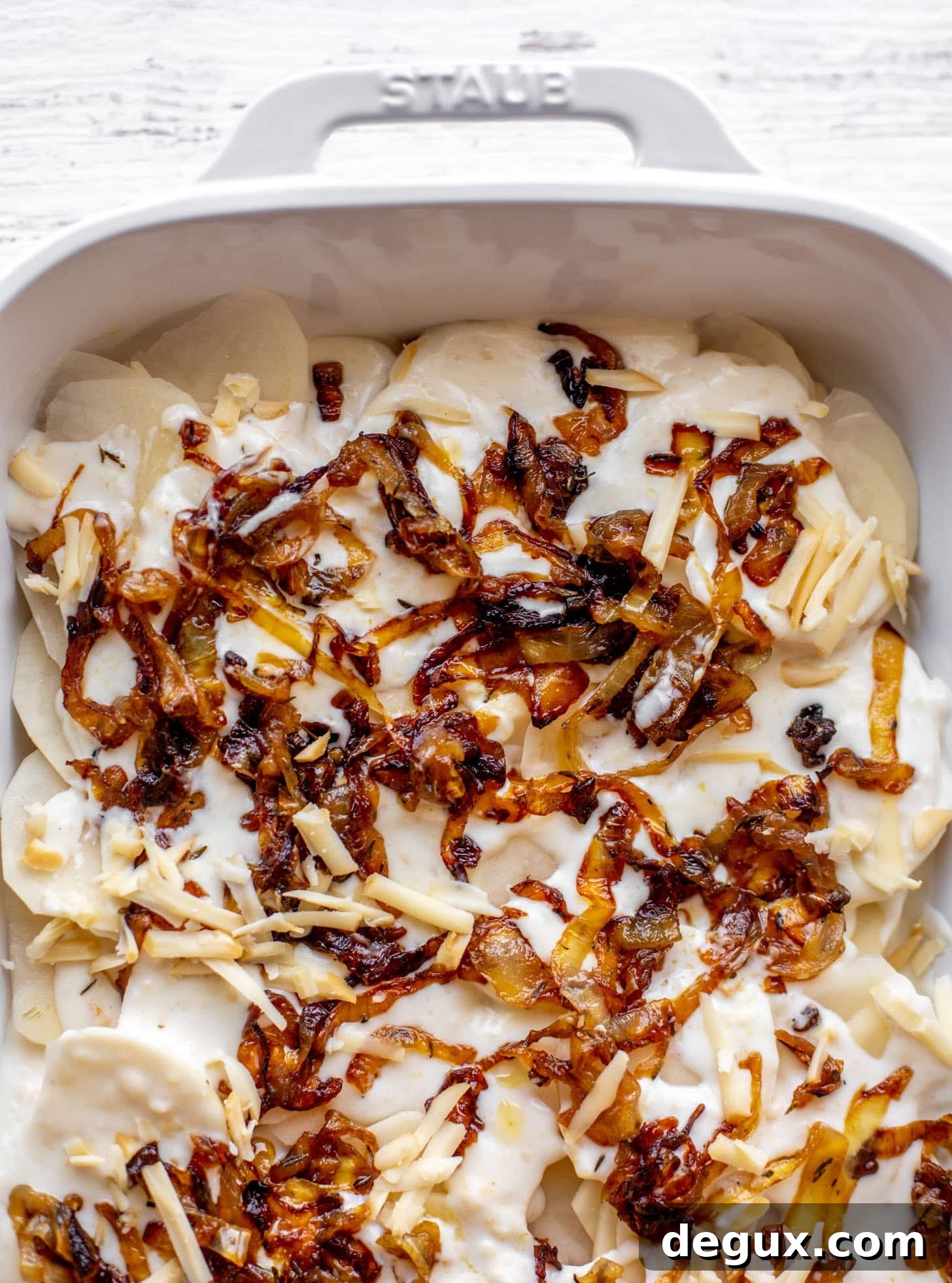 Creamy French Onion Scalloped Potatoes Recipe 4 layering potatoes, sauce and caramelized onions
