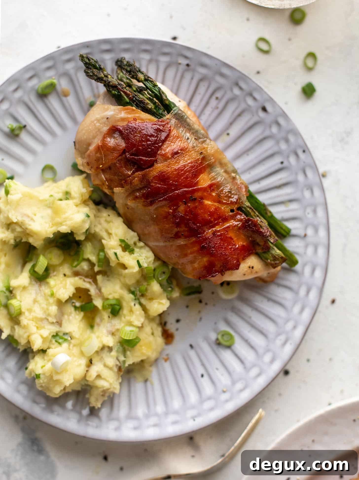 prosciutto wrapped asparagus stuffed chicken with scallion smashed potatoes