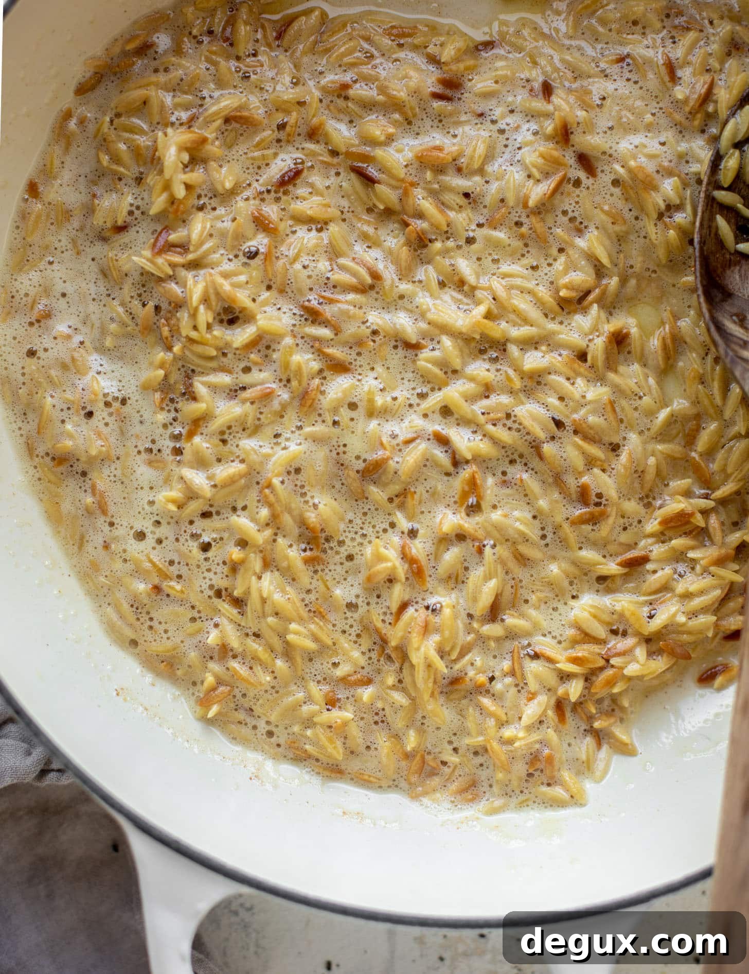 orzo toasting in brown butter