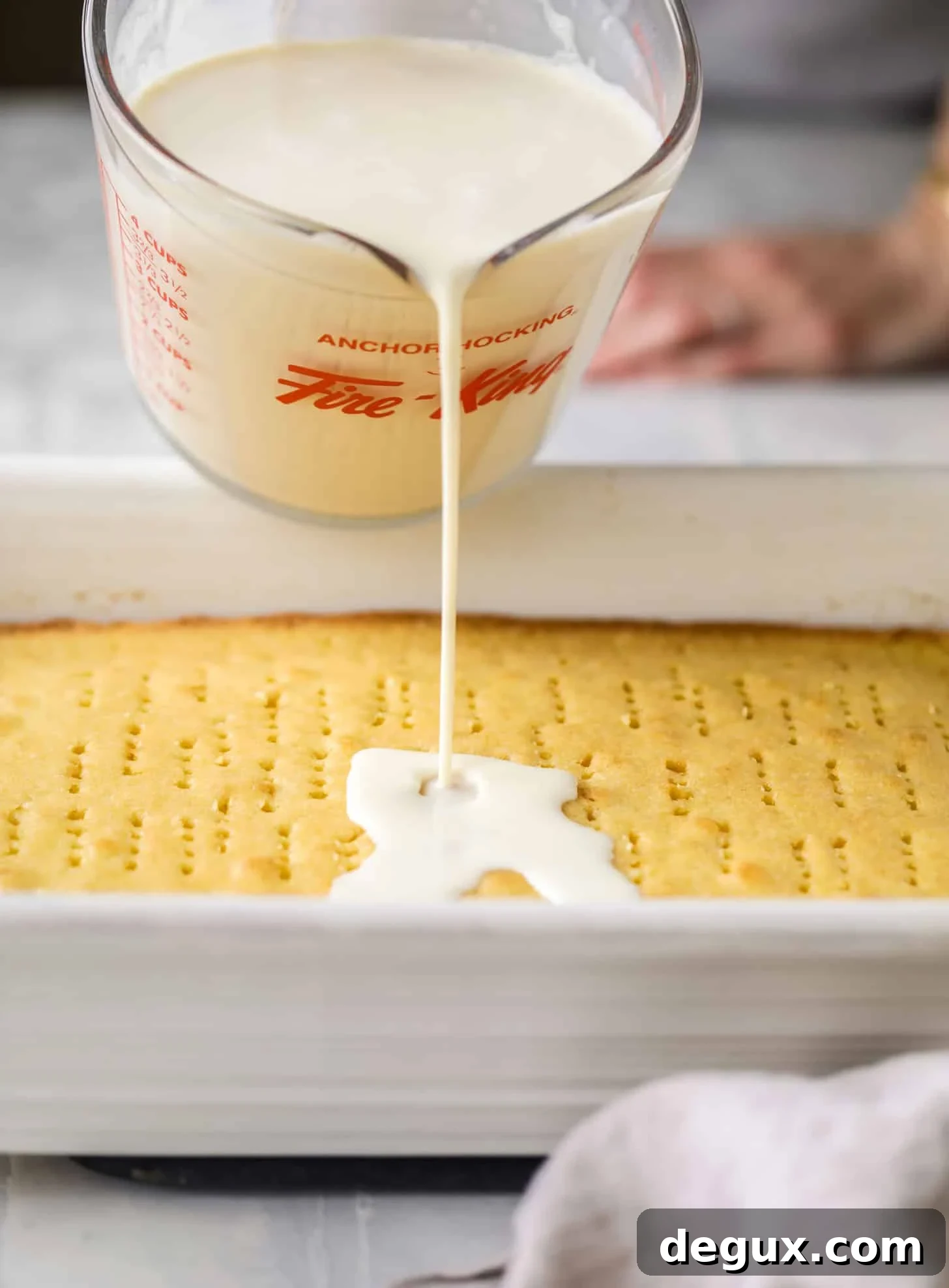 pour milk on tres leches cake