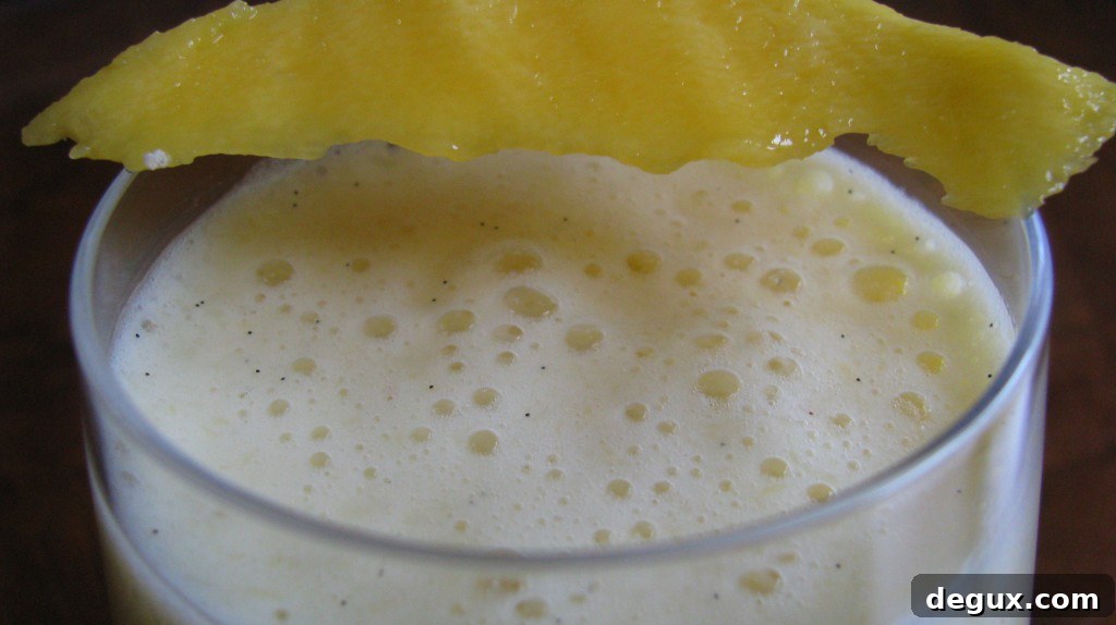 Mango smoothie in glass Mango smoothie in glass