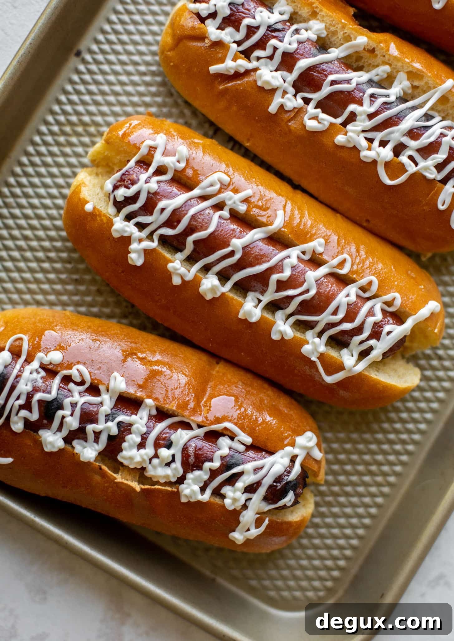 Flaming Hot Cheetos Hot Dogs: Spicy Cheeto-Topped Hot Dog Recipe 3 grilled hot dogs with mayo drizzle