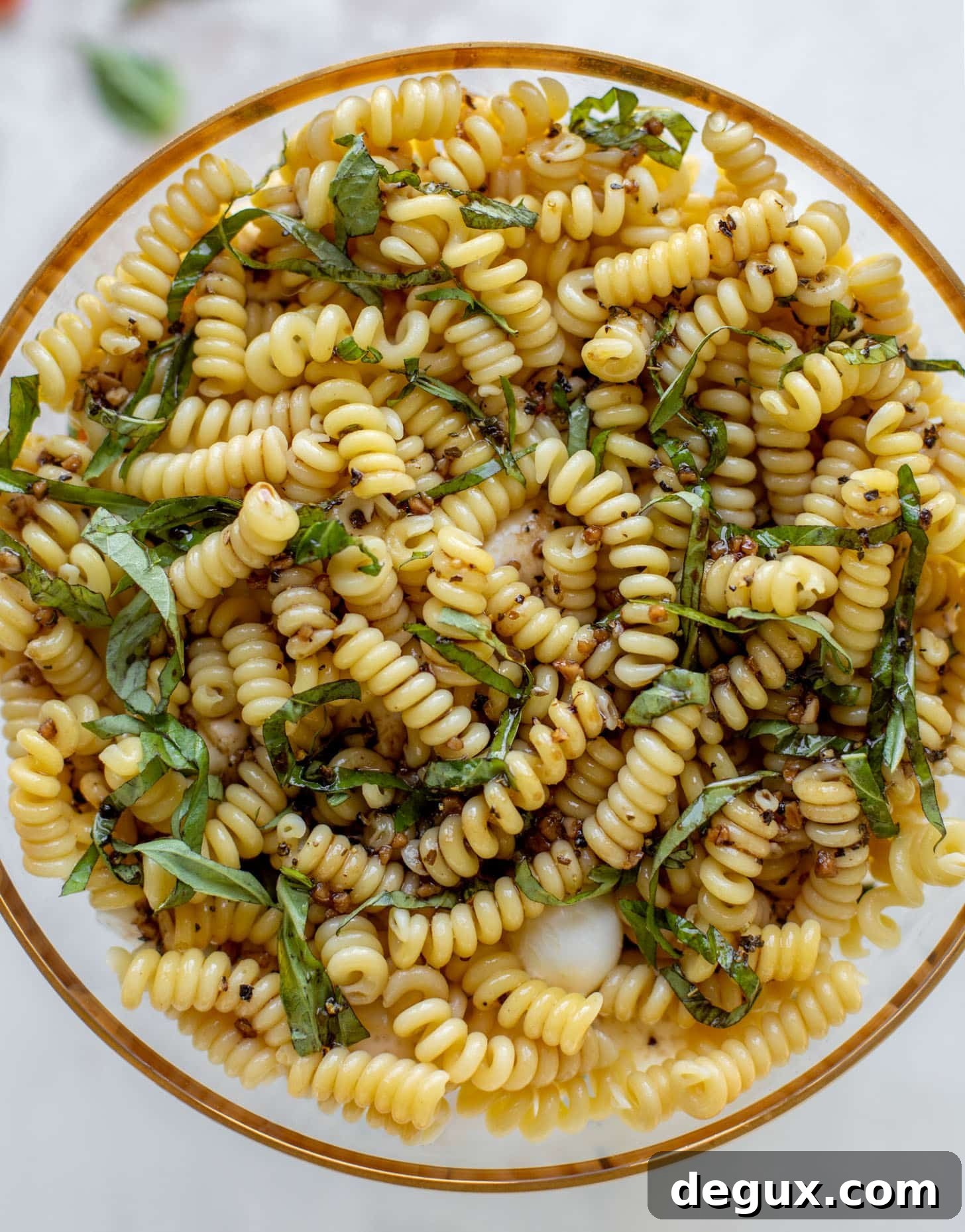 pasta and fresh basil with dressing