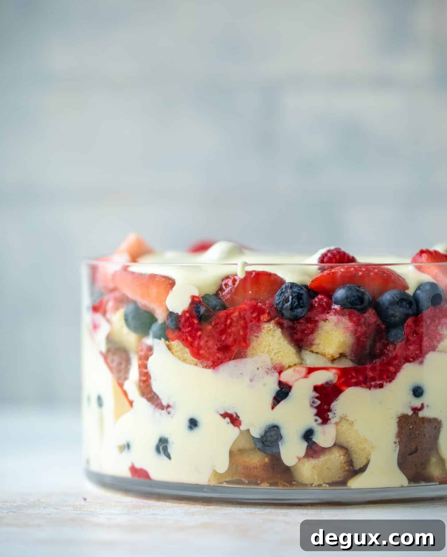 triple berry trifle with raspberry sauce