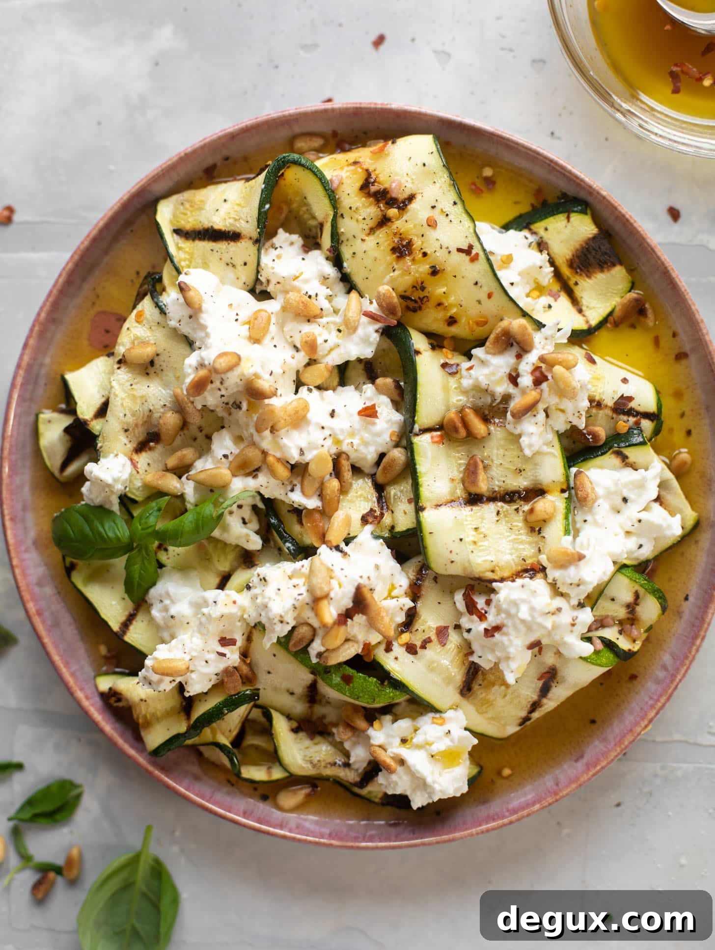 grilled zucchini with burrata and pine nuts