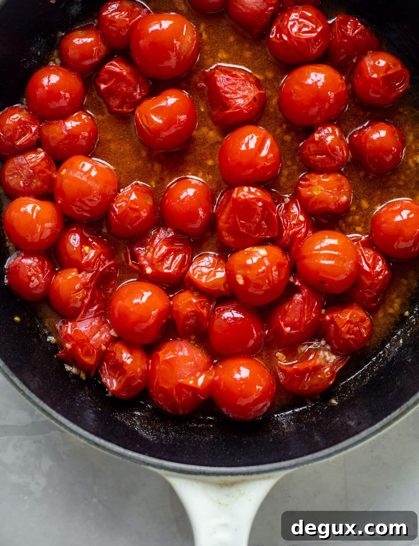 Skillet Cherry Tomato and Zucchini Lasagna 4 burst tomatoes in a skillet
