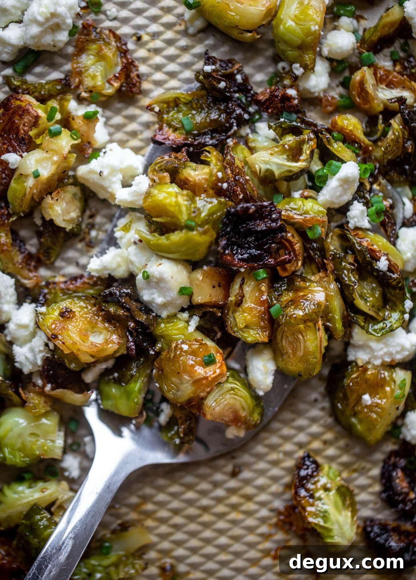 hot honey roasted brussels sprouts on a sheet pan