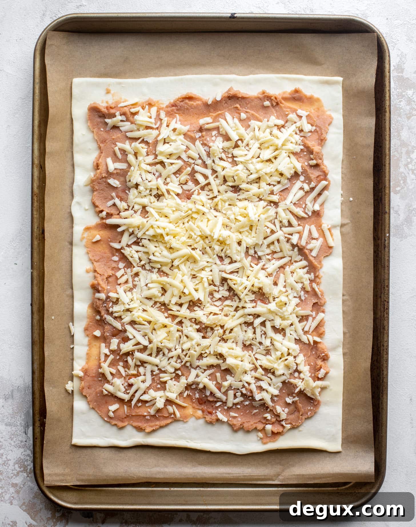 Taco Puff Pastry Pizza Recipe: Flaky Taco Pizza for Parties 3 puff pastry with refried beans and cheese