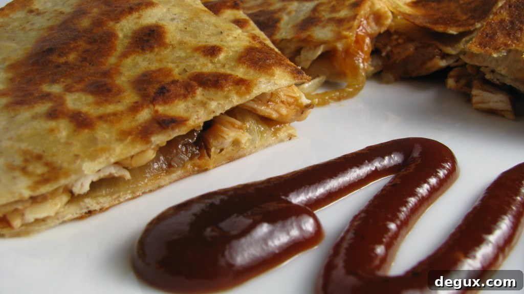 Plated quesadilla with sauce and garnish