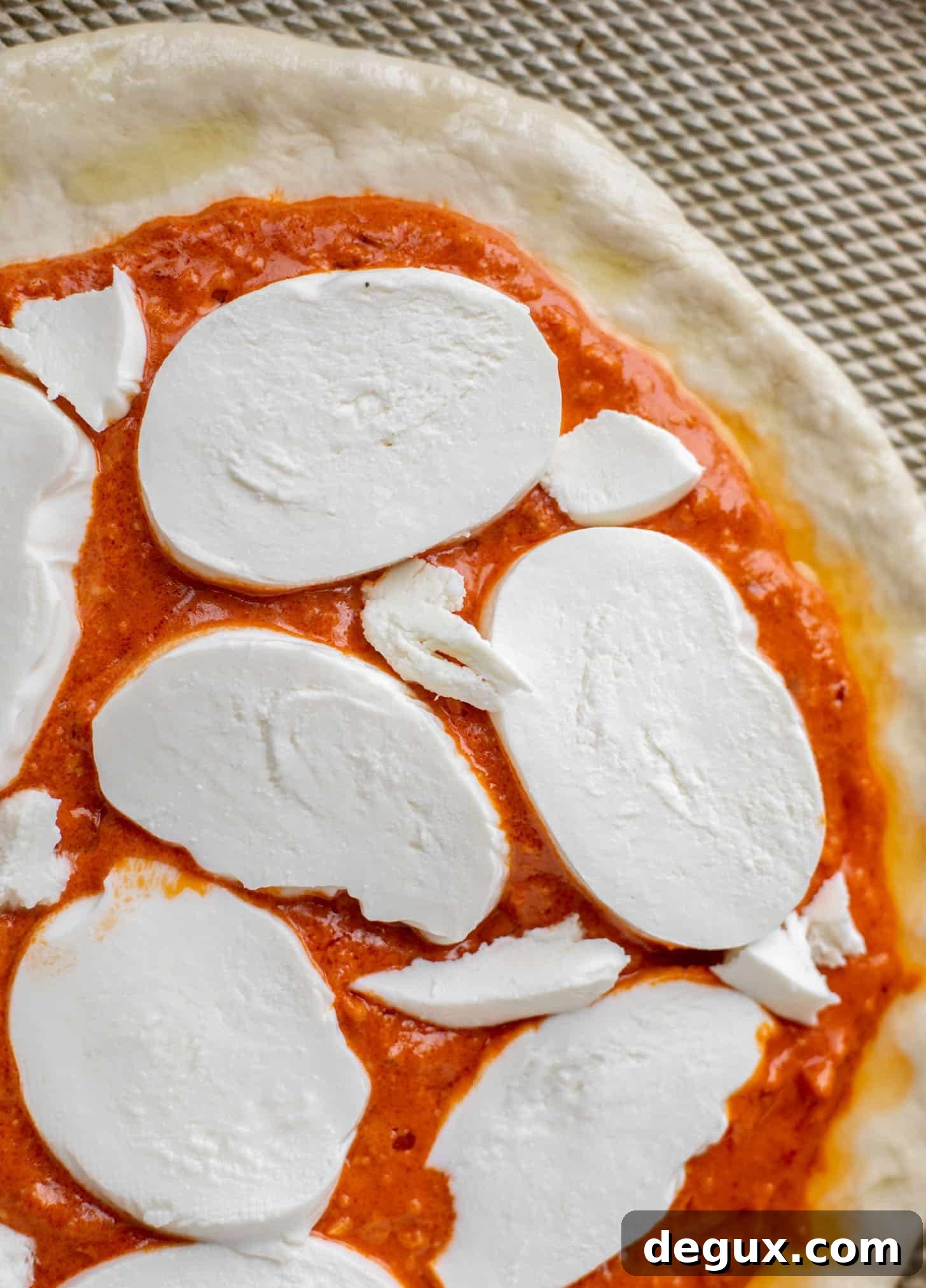dough with sauce and cheese