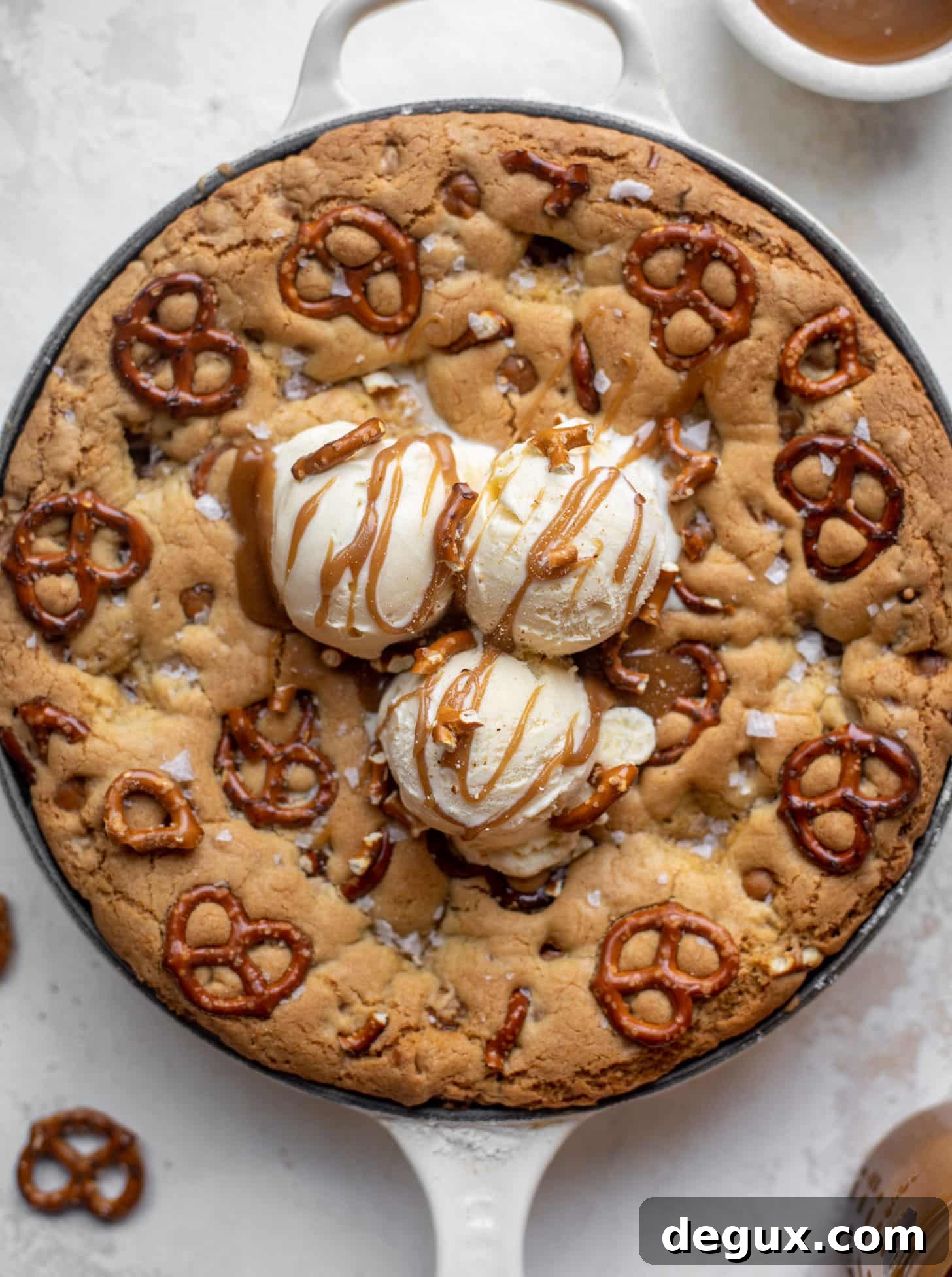 caramel pretzel skillet cookie with ice cream