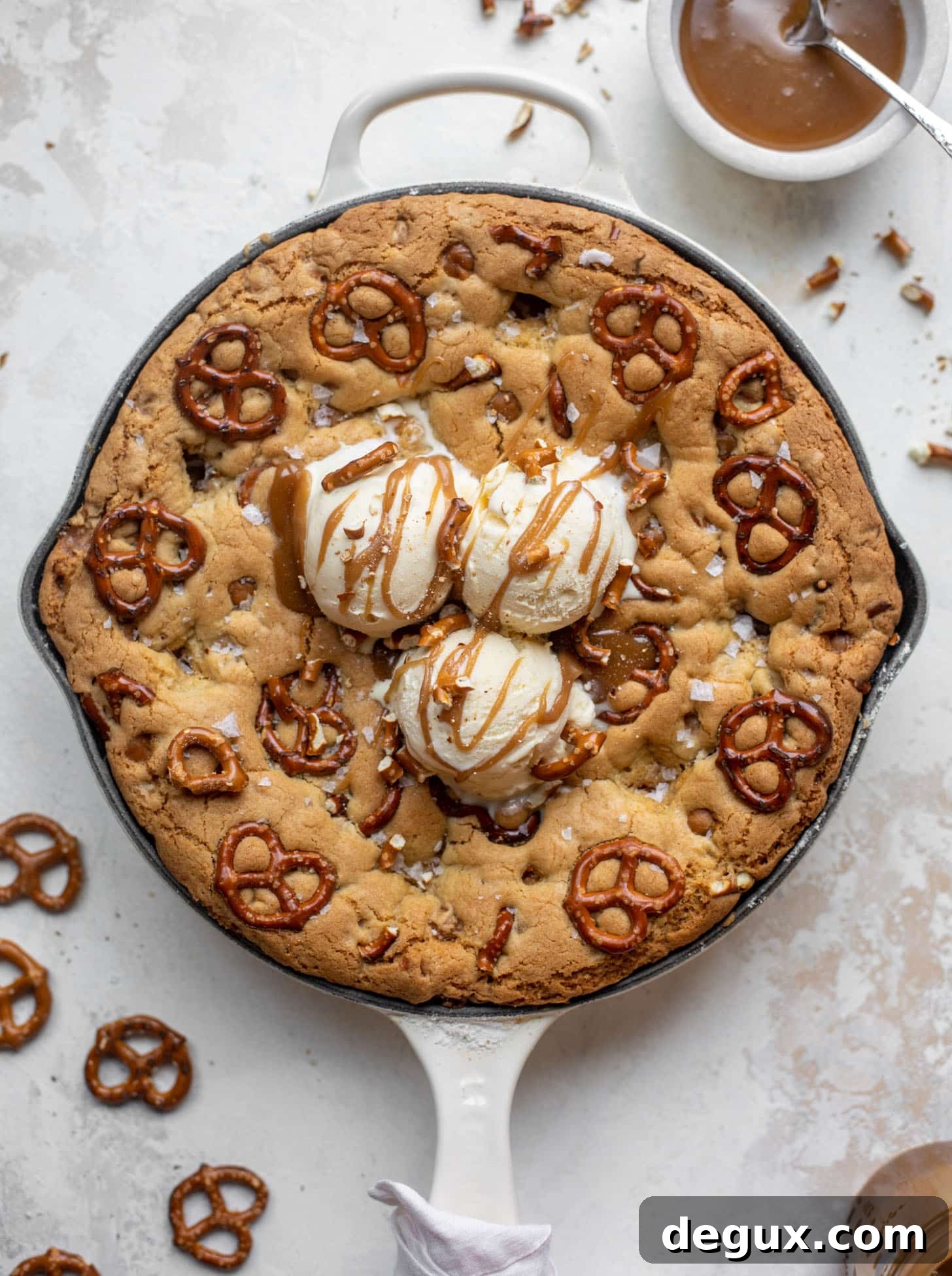caramel pretzel skillet cookie with ice cream